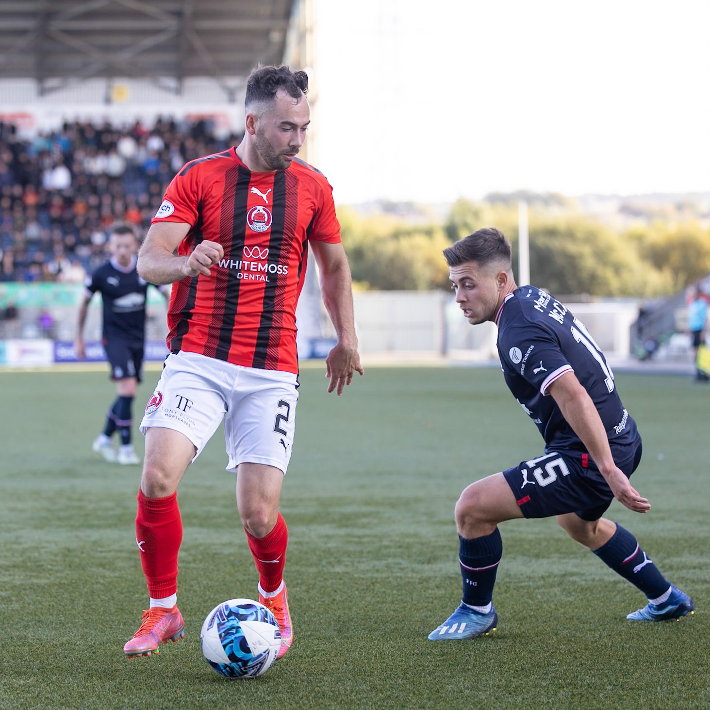 Falkirk FC v Clyde FC - Scottish league one, 01 October 2022Ross Lyon of Clyde FC shields the ball from Leon McCann of Falkirk FC