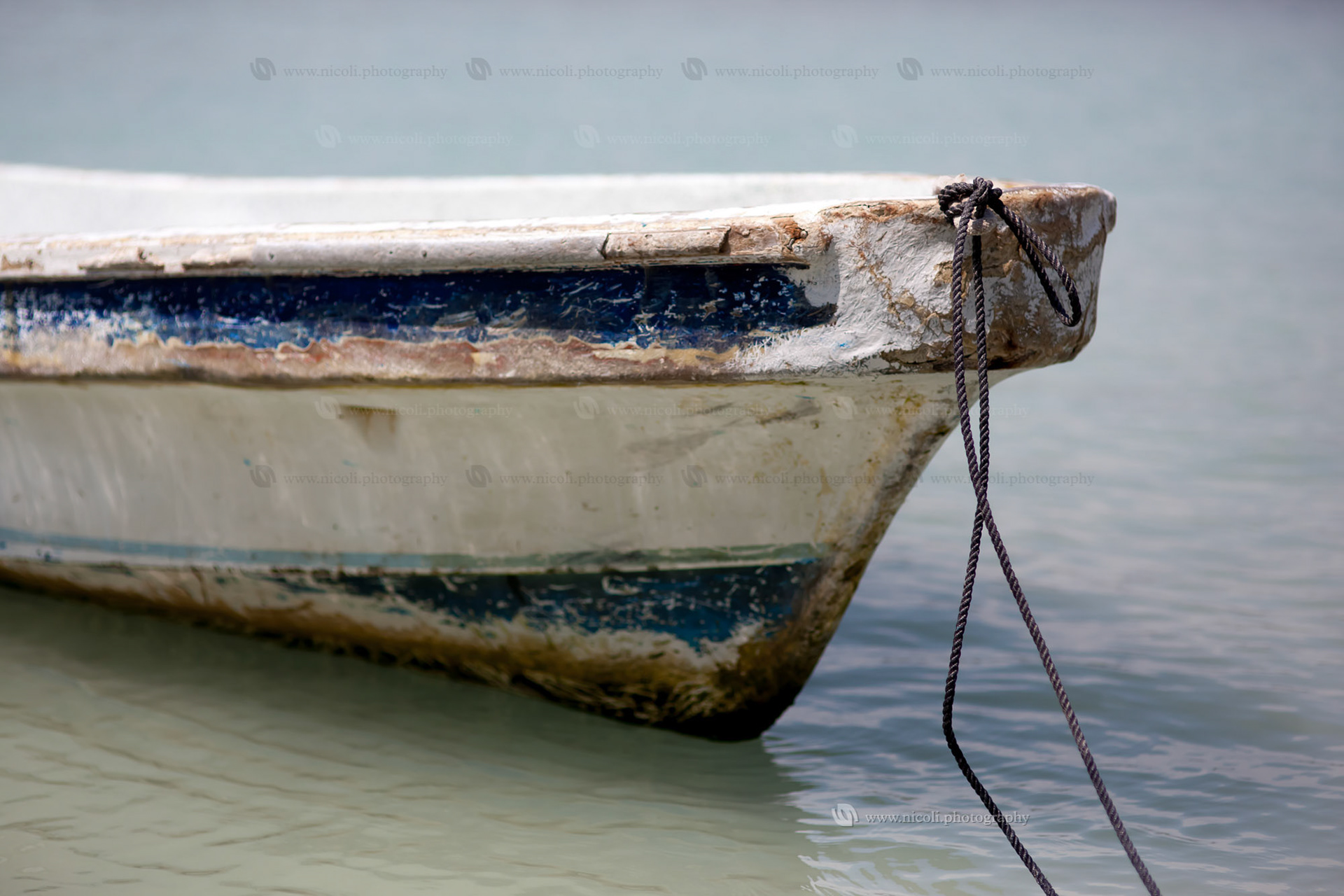 Boat tip and rope. Focus is on rope. Shallow depth of field.