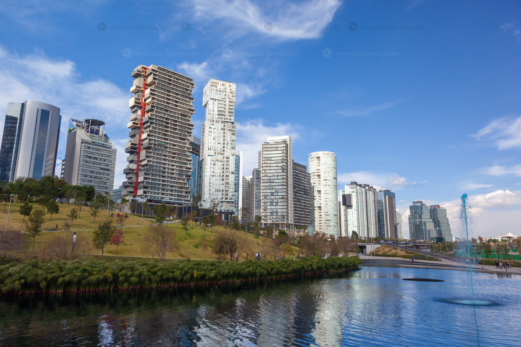 MEXICO CITY, MEXICO - DEC, 27, 2018: La Mexicana Park with modern and beautiful skyscrapers on Santa Fe, Mexico City's major business districts.