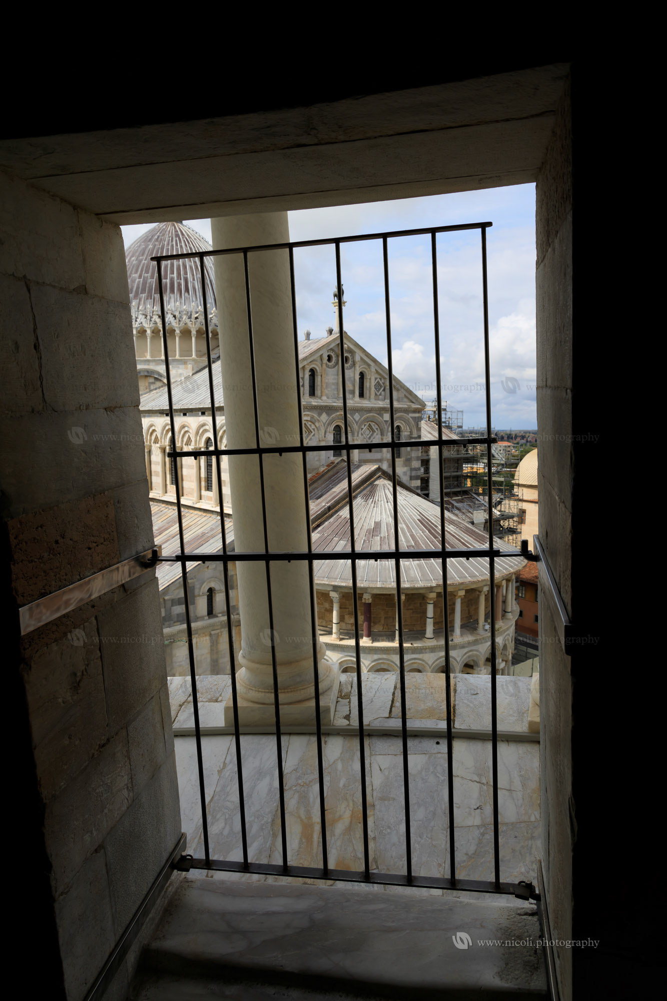 View of Pisa from inside the Tower, focus is on the background.