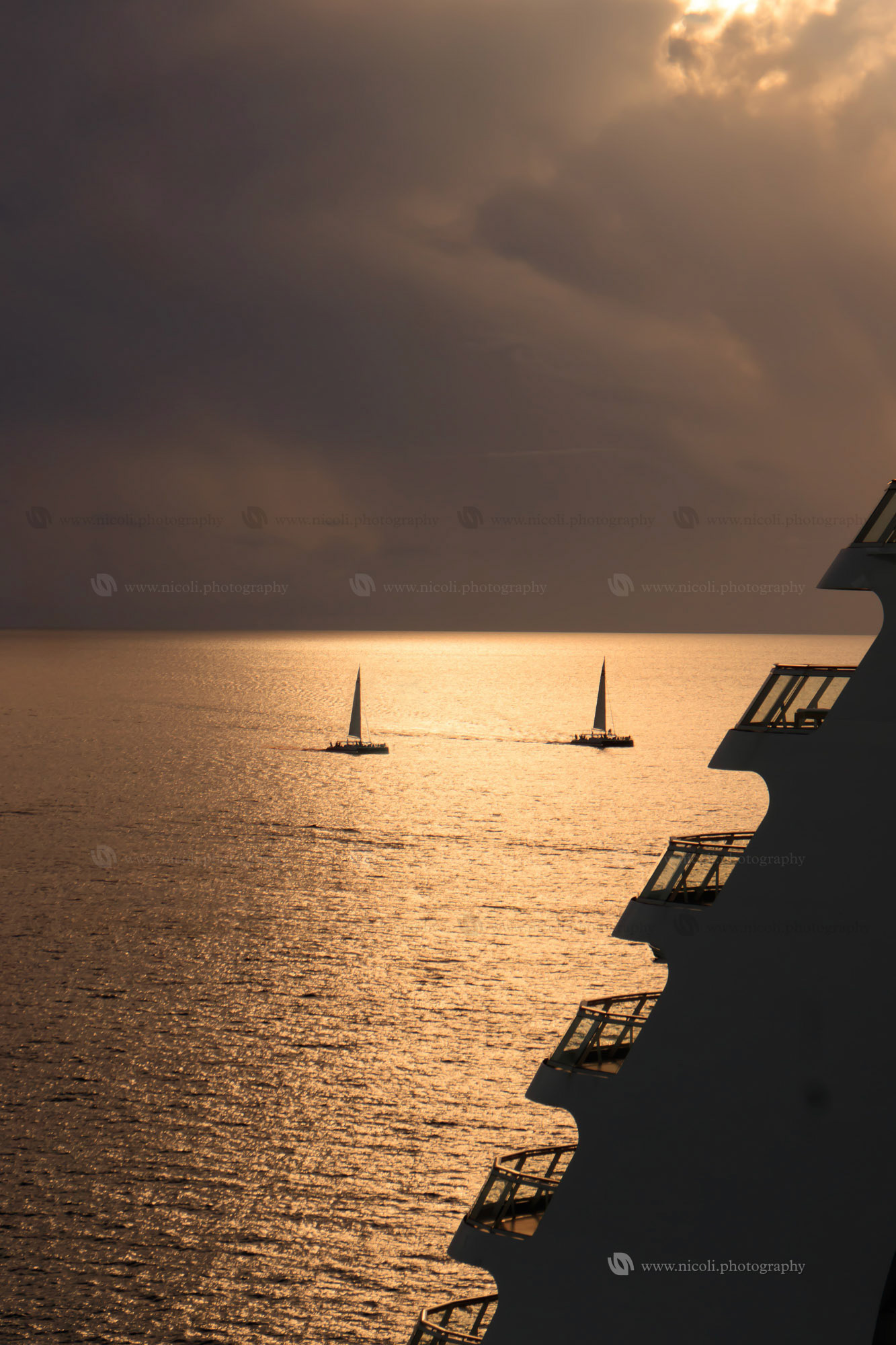 Sail boats, cruise and sunset in Cozumel