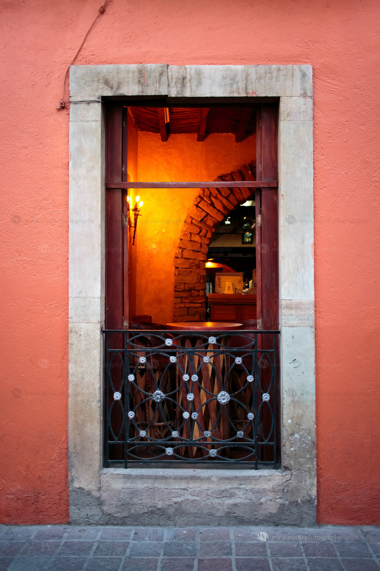 GUANAJUATO, MEXICO -  APR, 20, 2013: Restaurant seen through a window in the historic town of Guanajuato. Guanajuato, Mexico on Apr, 20, 2013.