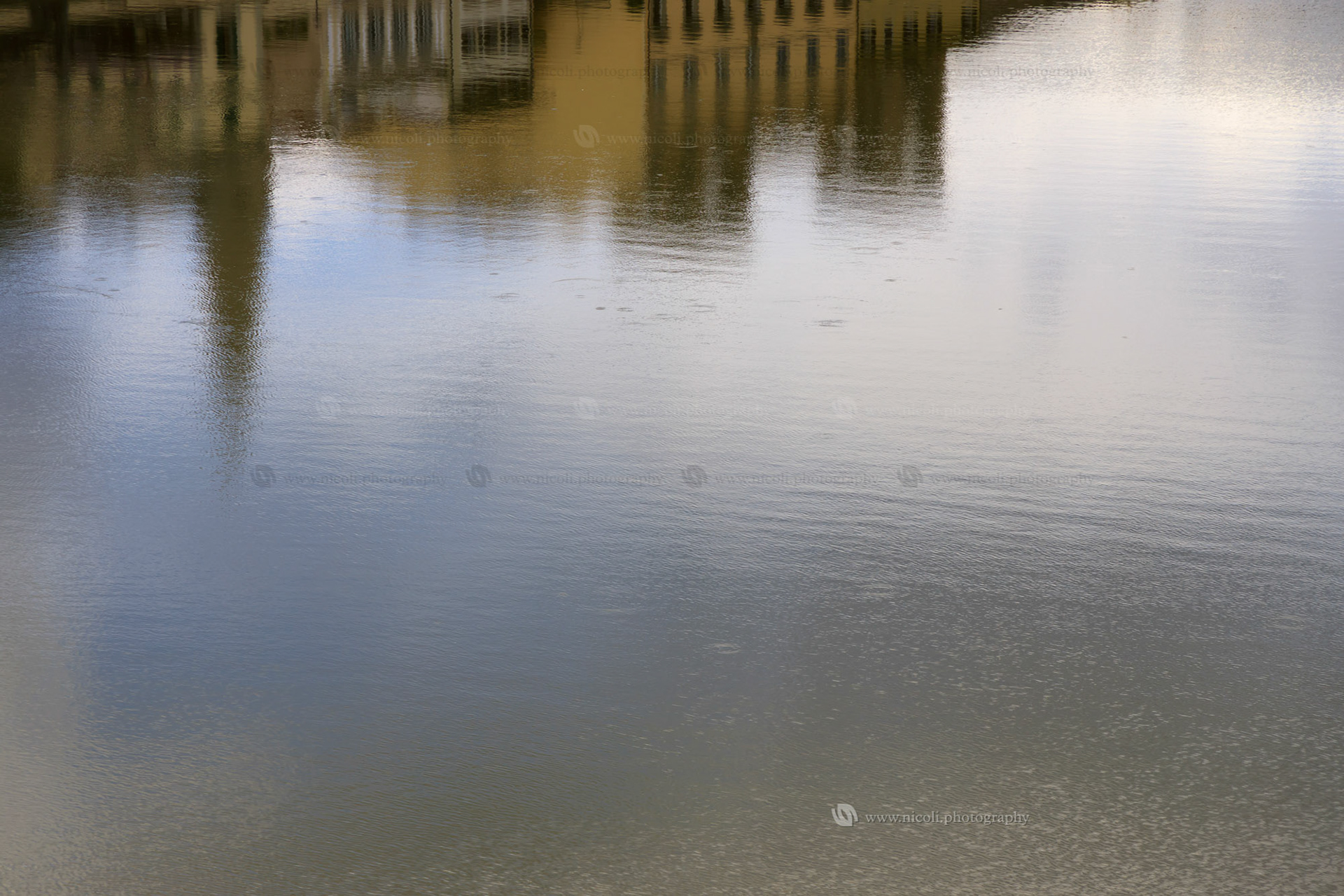 Reflection in the Arno river in Florence, Italy