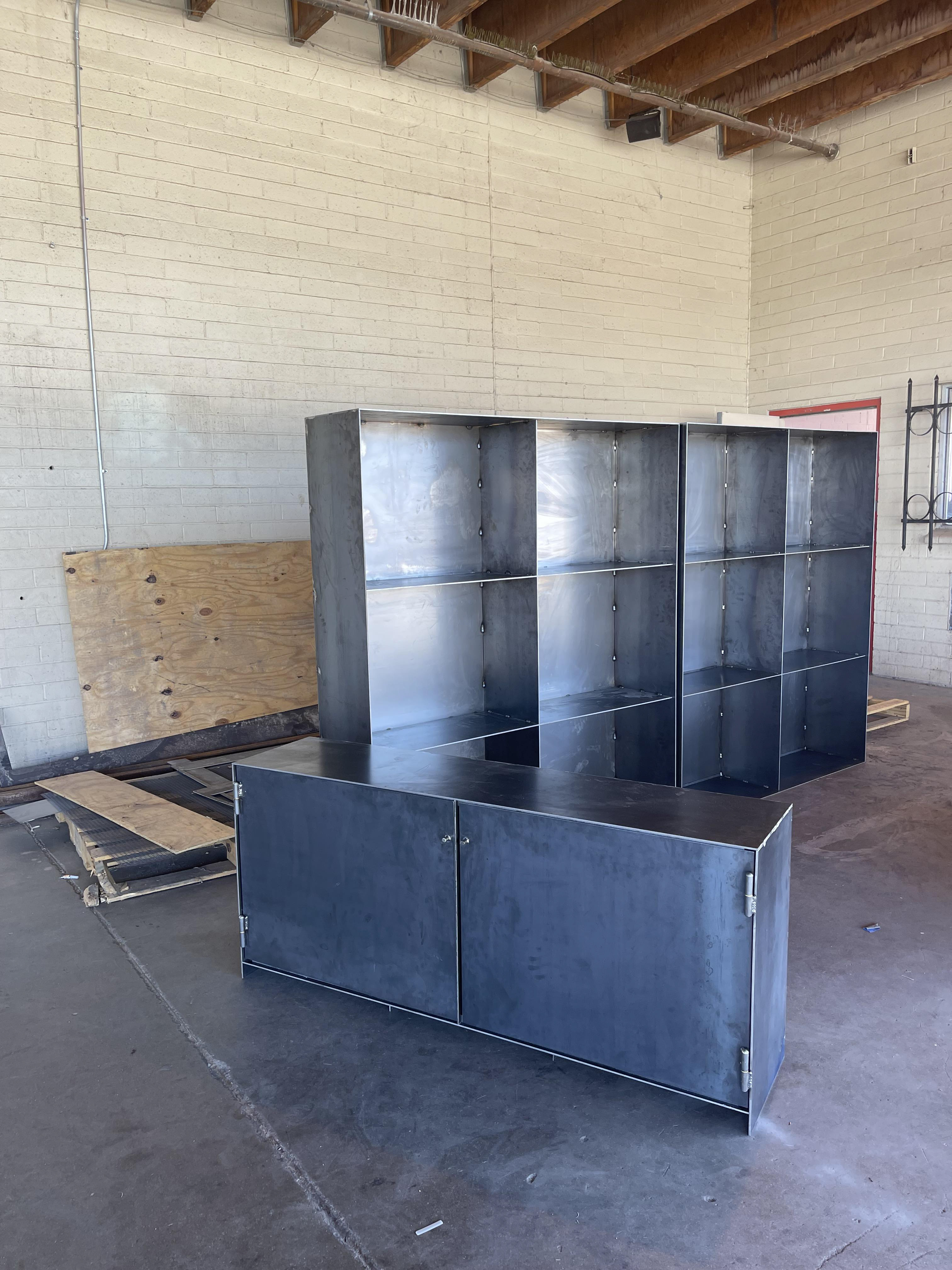 One Solid steel base sitting in front of unfinished top parts