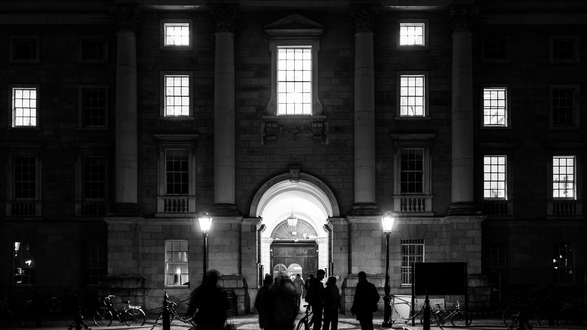Night, people and lit windows
