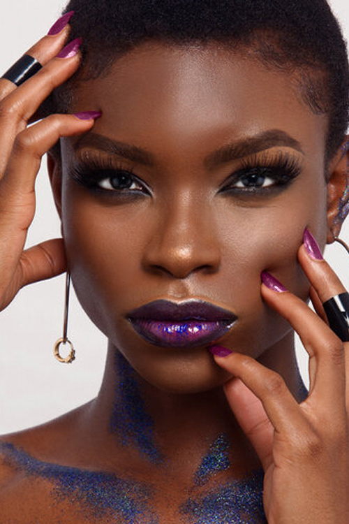 Beauty and make up project with purple glitter, lipstick and fingernails
