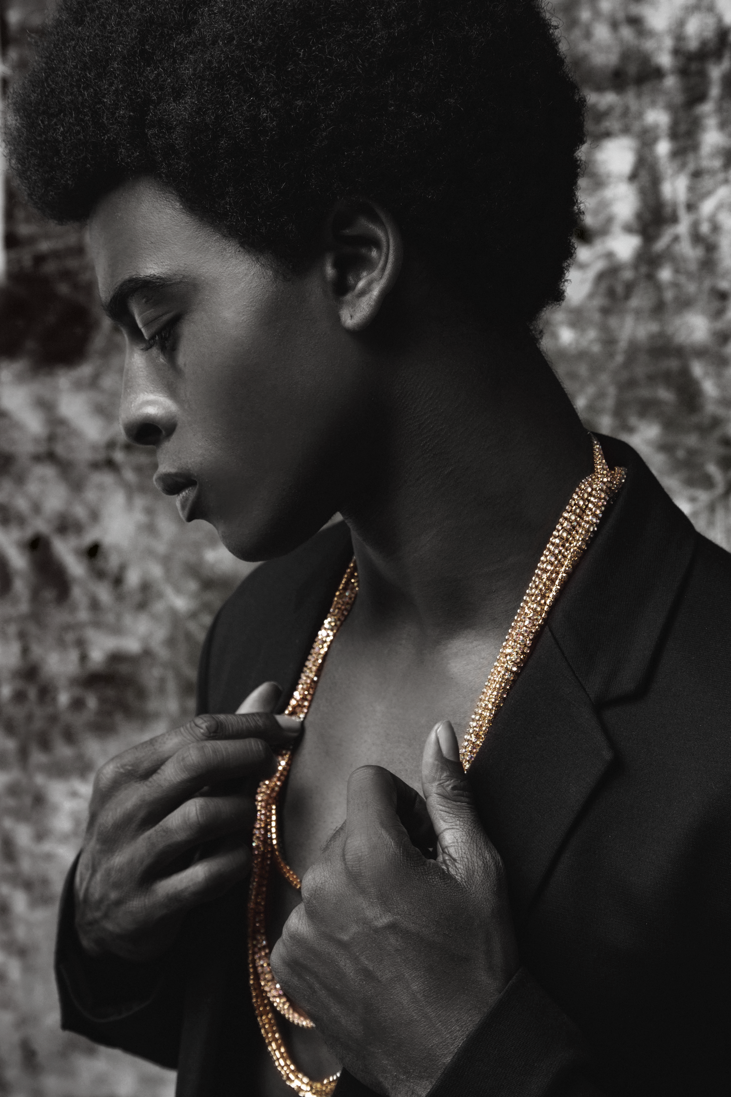 A stunning close up with a male model in the frame wearing a blazer for a fashion project