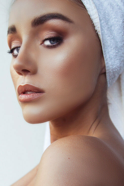 a strong gaze by a model for a beauty campaign shoot