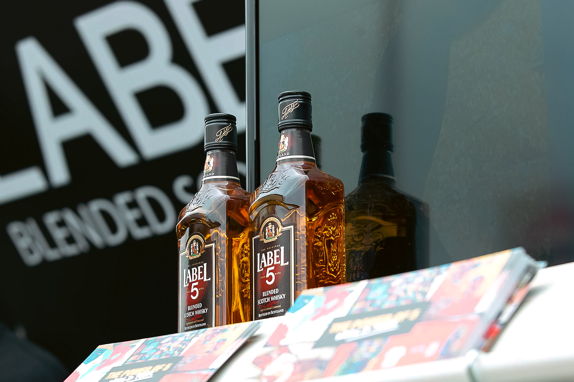 Two bottles of label 5 whiskey on display at the popup event