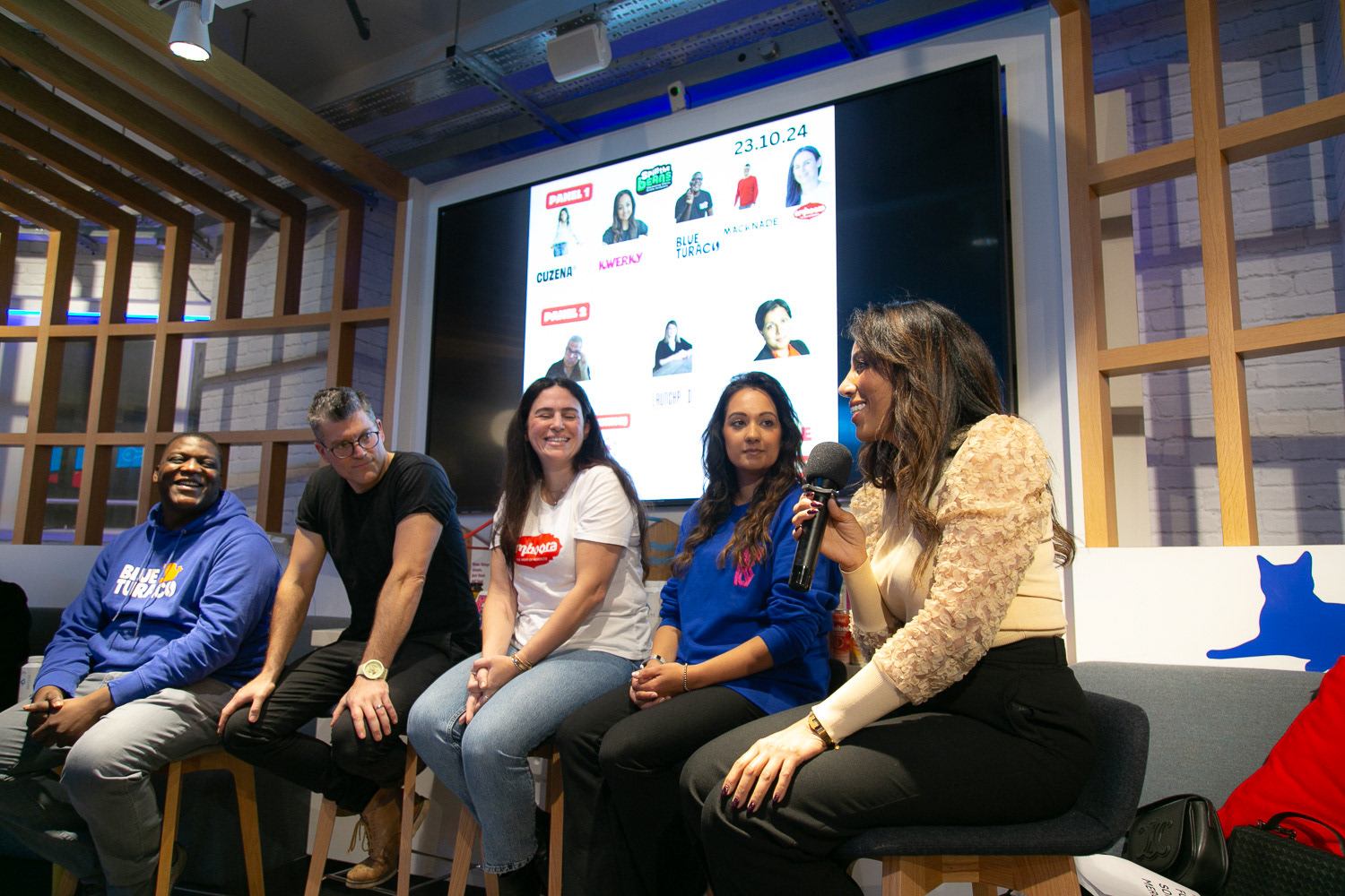 A panel of speakers at a food and beverage event with a female speaker sharing some insights with the audience
