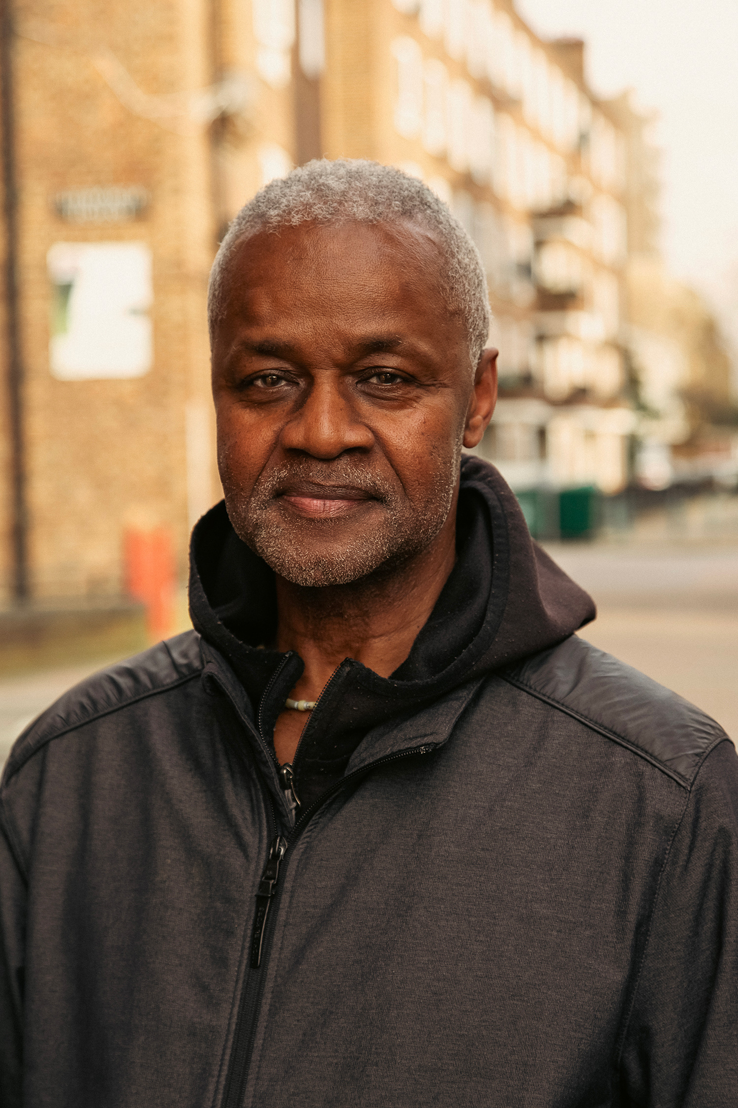 Natural light portrait of a gentleman who was part of a podcast series about a local community, shot with the estate in the background