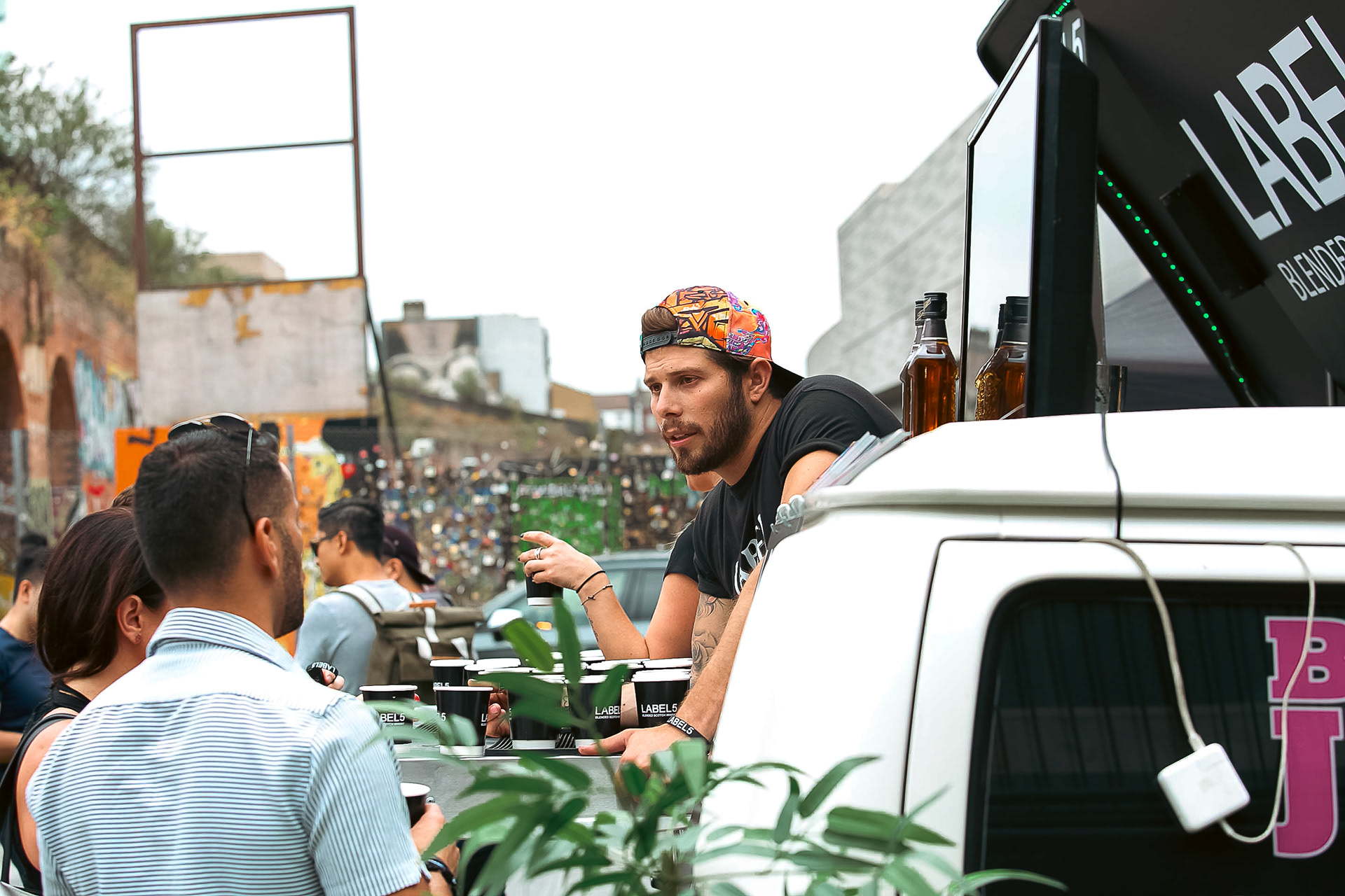 Label 5 staff answering any customer queries about the drink 