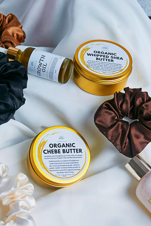 Haircare products on a white cloth for lifestyle shoot