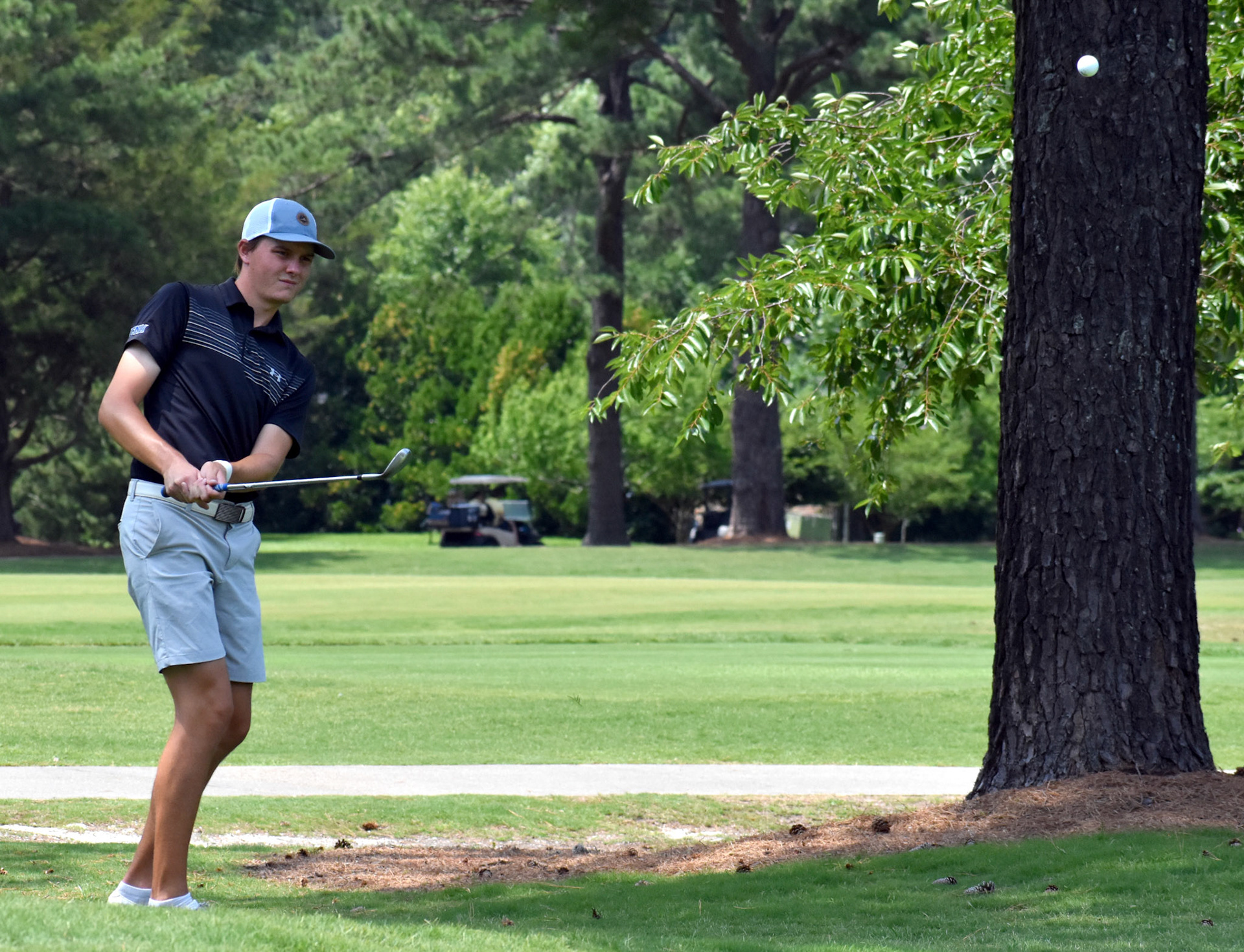 Alex Price chips to 13 green