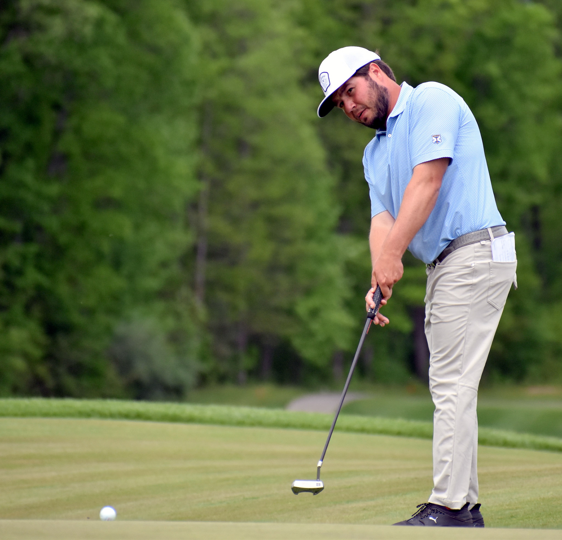 Tim Ritter rolls his putt on 13