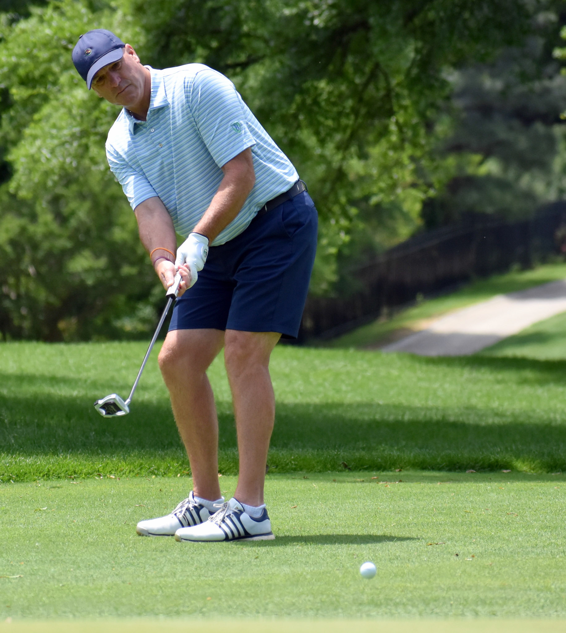 Cam Young putts from off the green on 13.