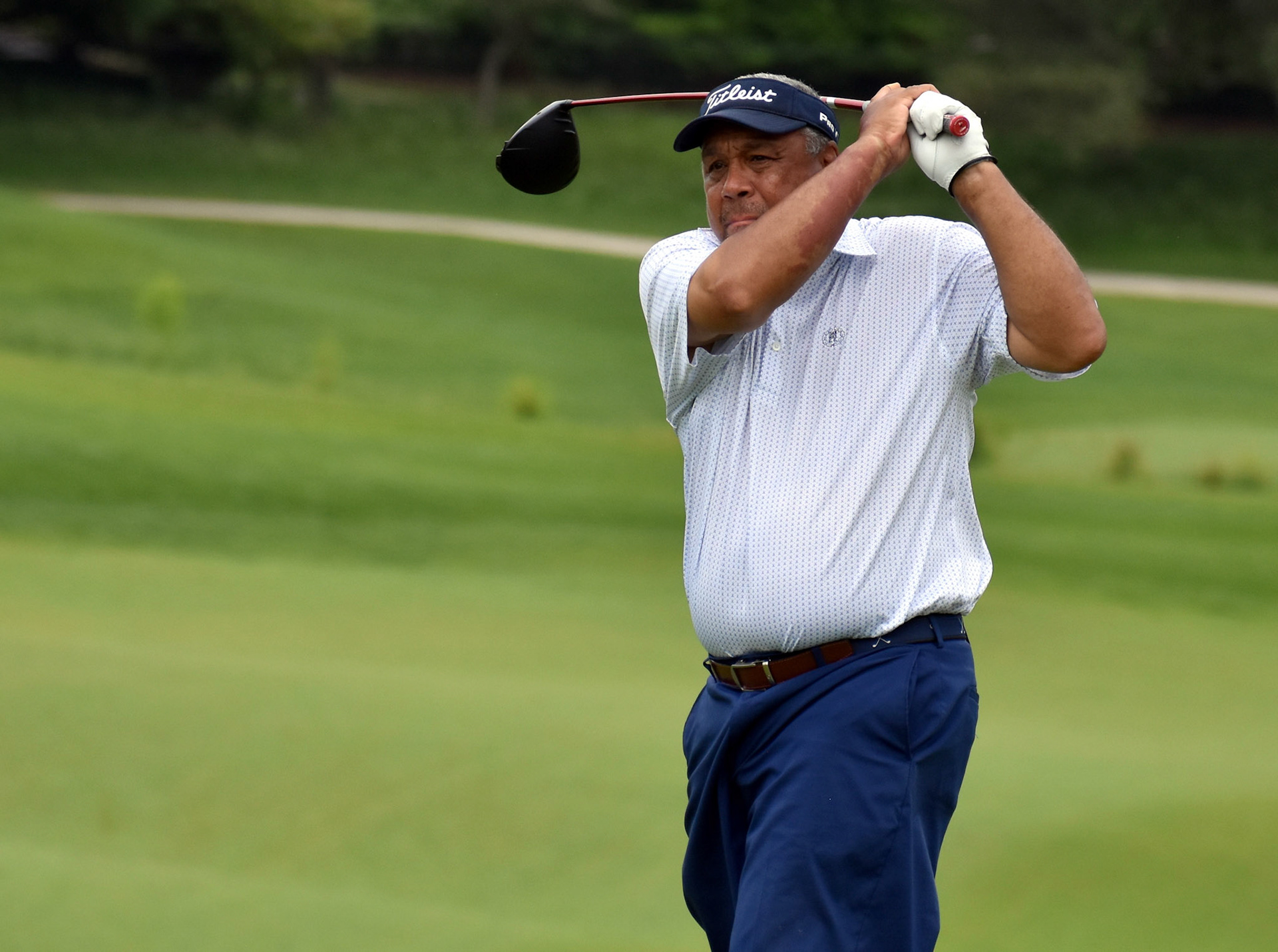 Randy Newsome watches his drive on 16.