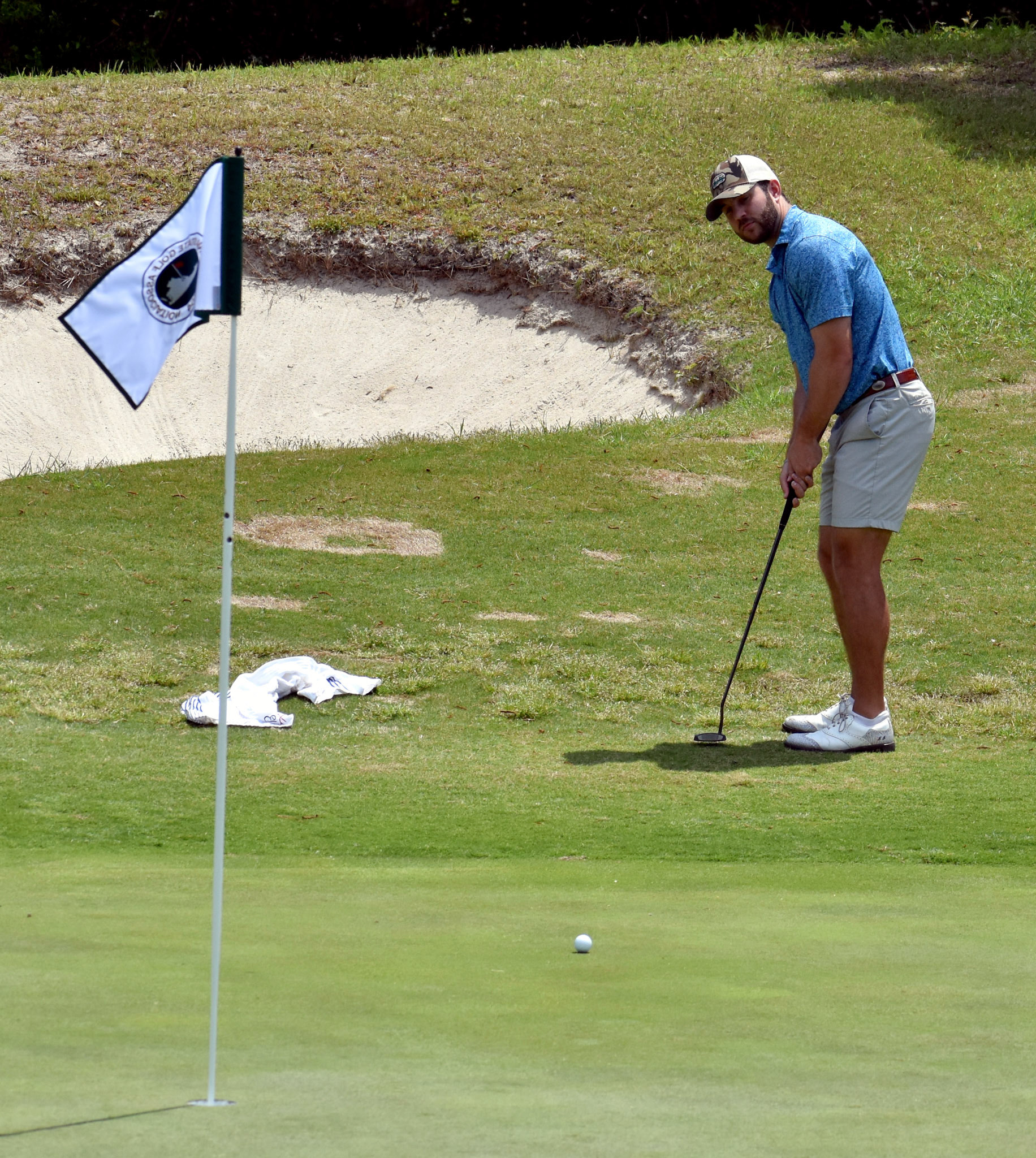 Joey Jordan putts from off the green on 6.