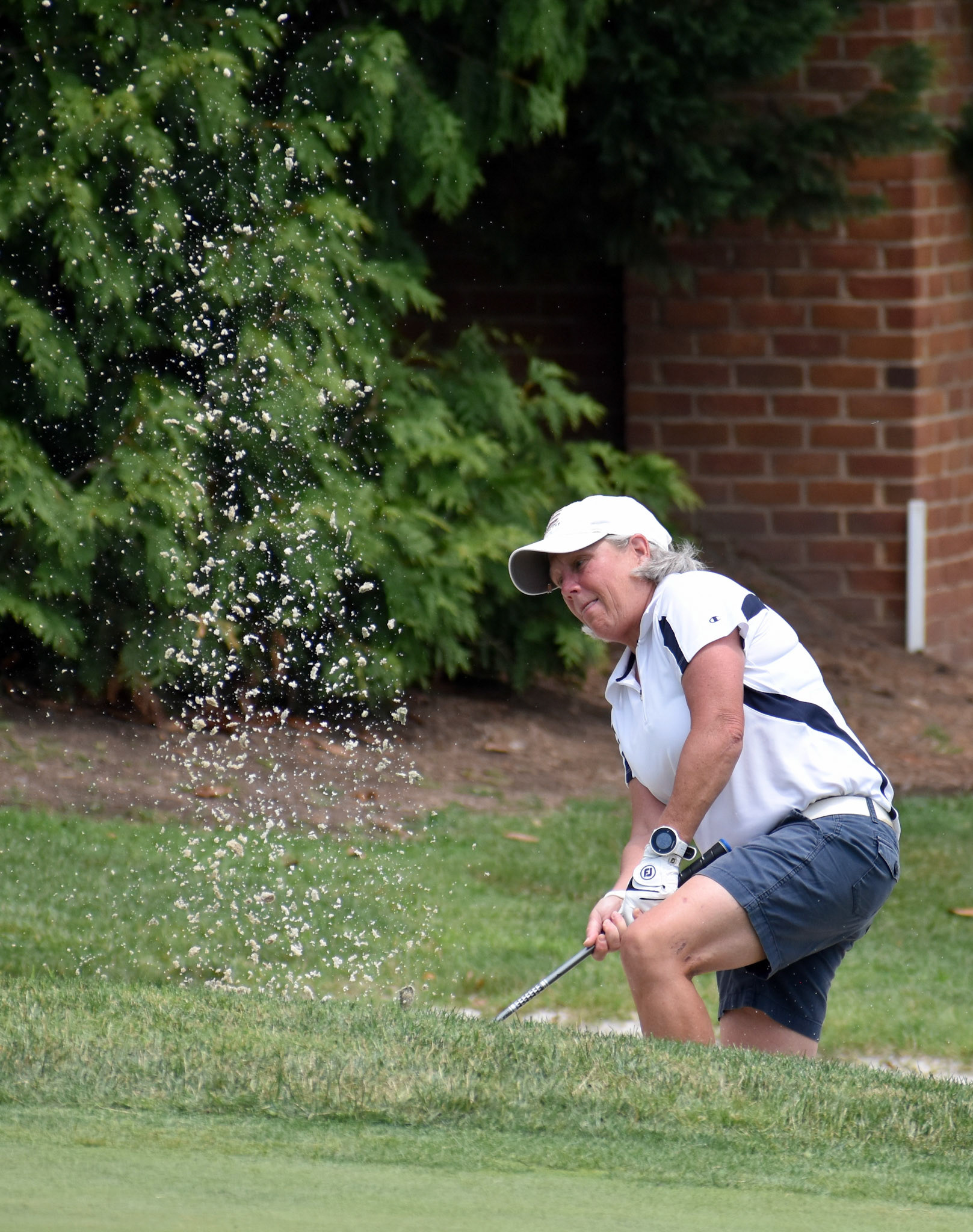 Cindy Thompson has to take a very tough stance to get out of the bunker on 9.