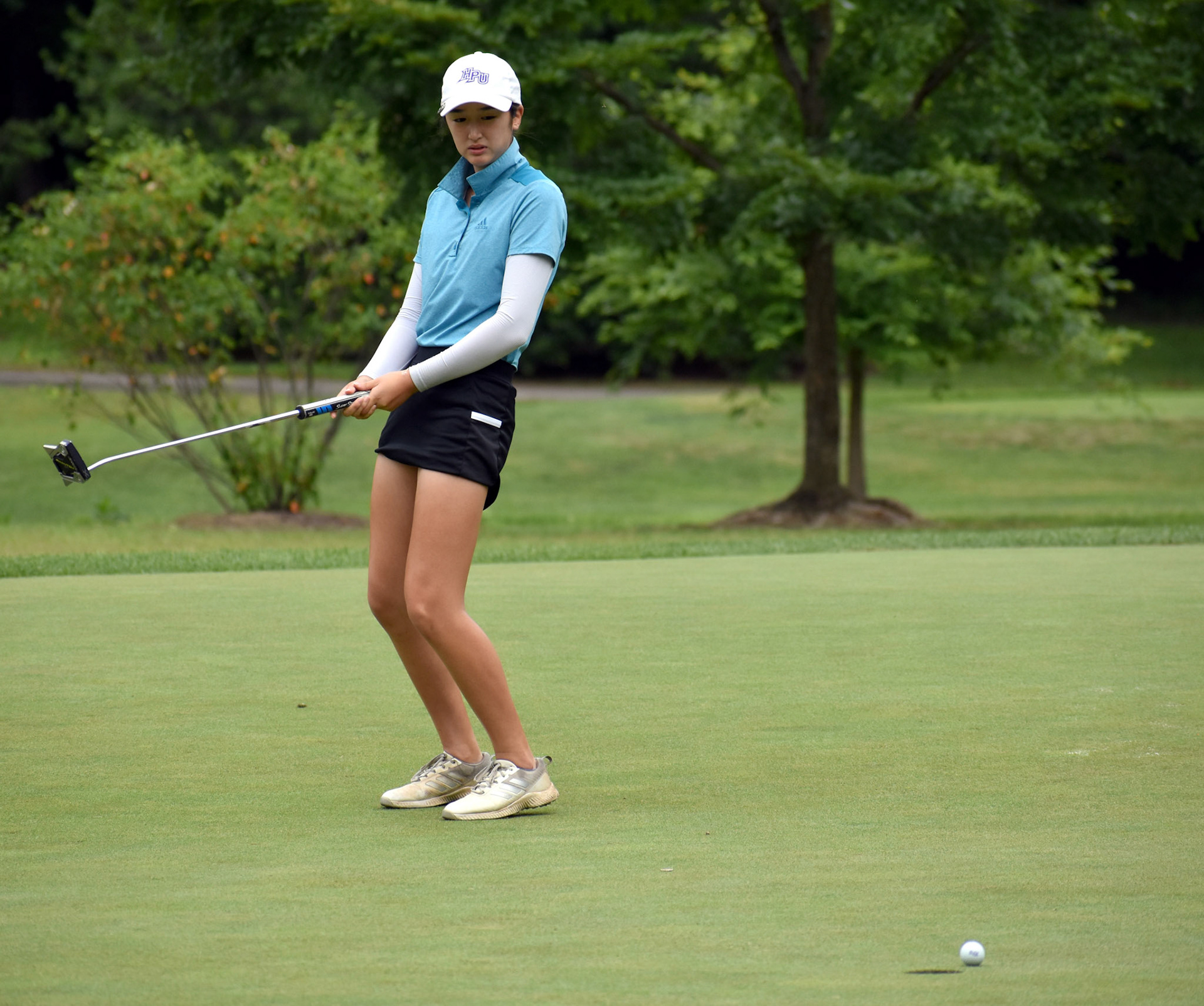 Danielle Suh reacts as her putt on 4 slides to the left.