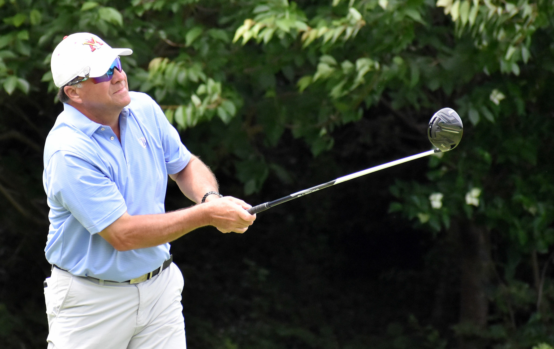 Robert Nussey Jr. tees off on 13.