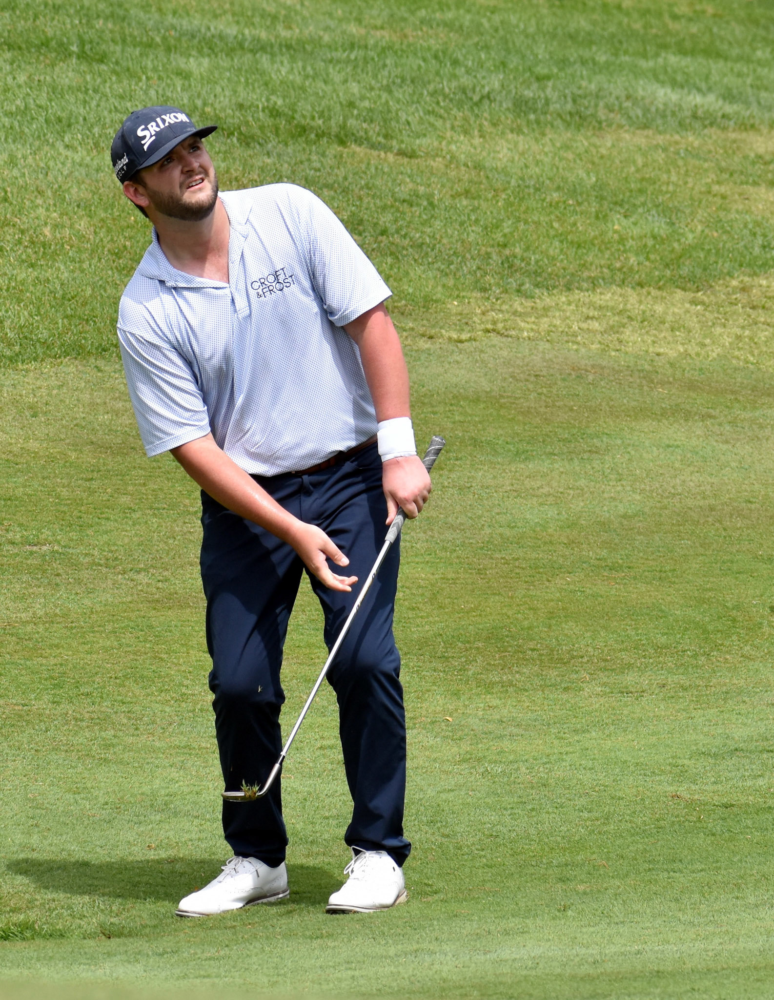 Mark Lawrence watches his chip to 10 green.