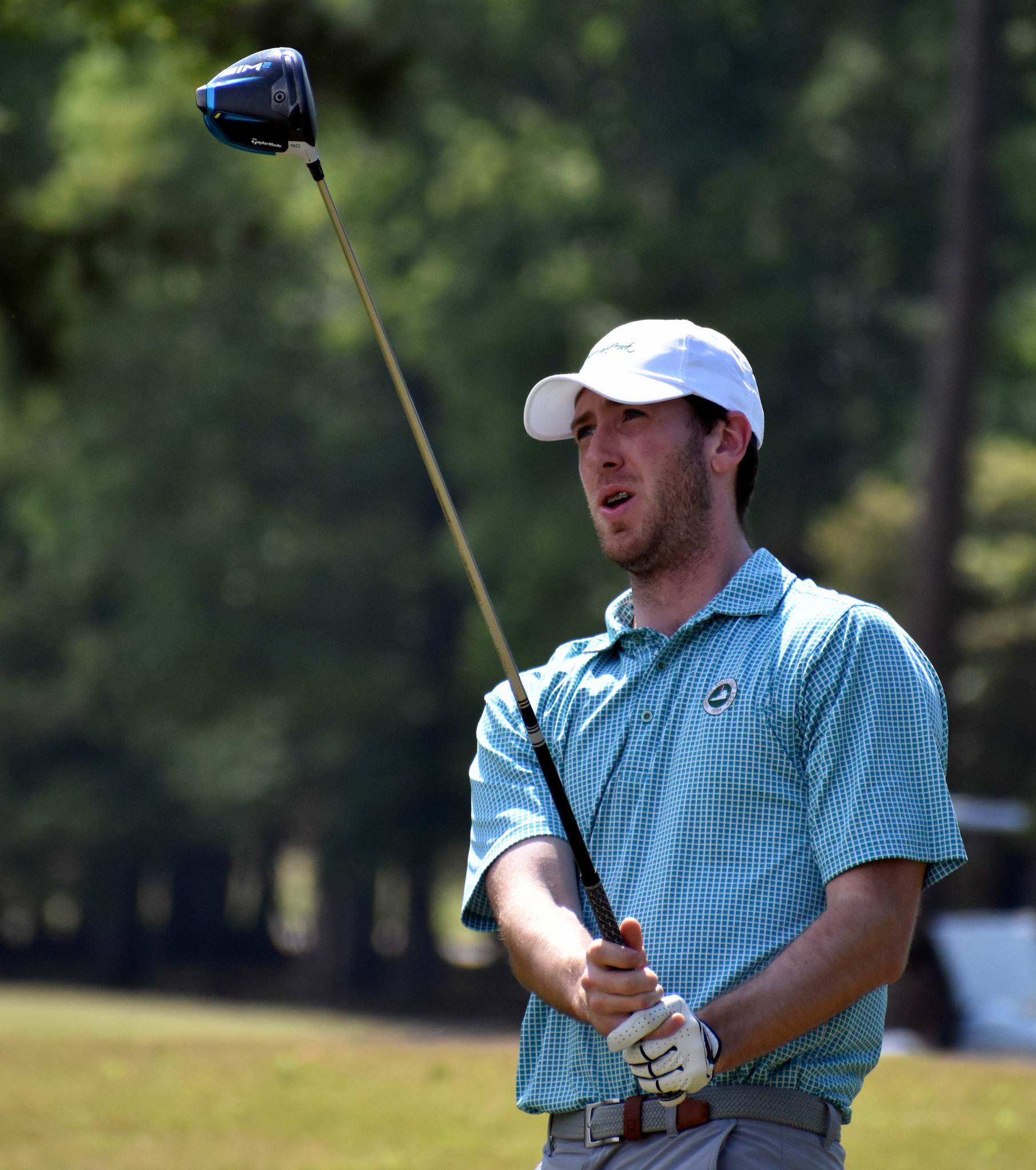 Andrew Kennedy watches his drive on 2