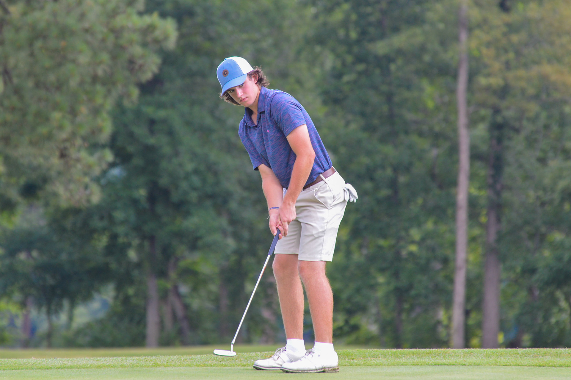 Grayson Wood watches his putt on 13