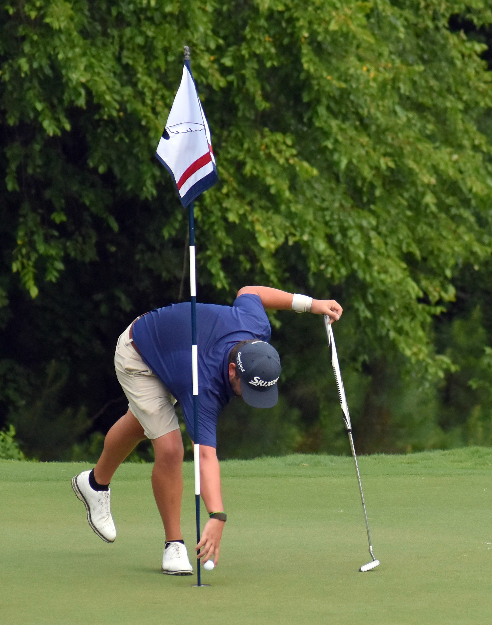 Mark Lawrence Jr. grabs his ball after holing out for eagle on 12.
