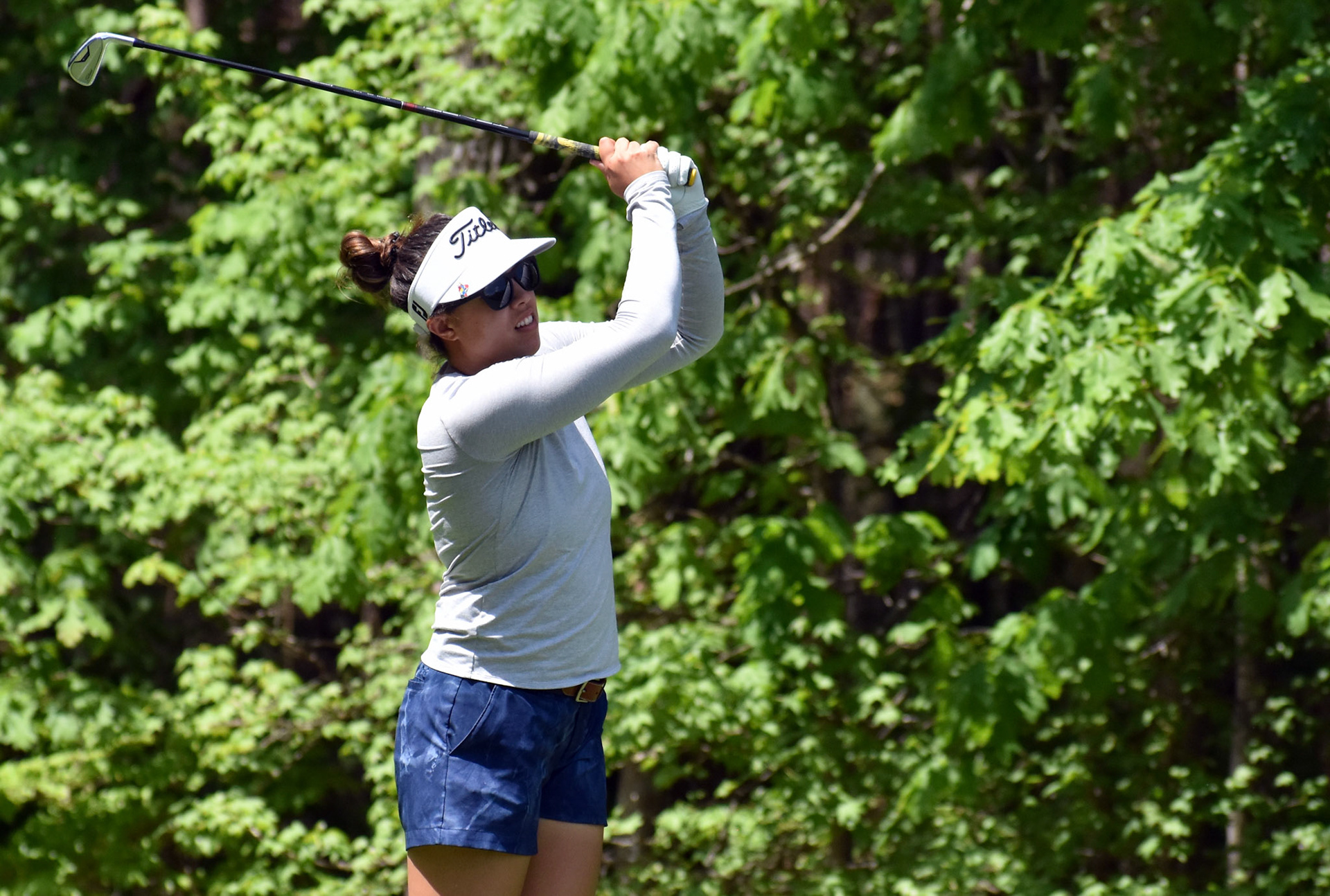Lauren Greenlief watches her tee shot on 12.