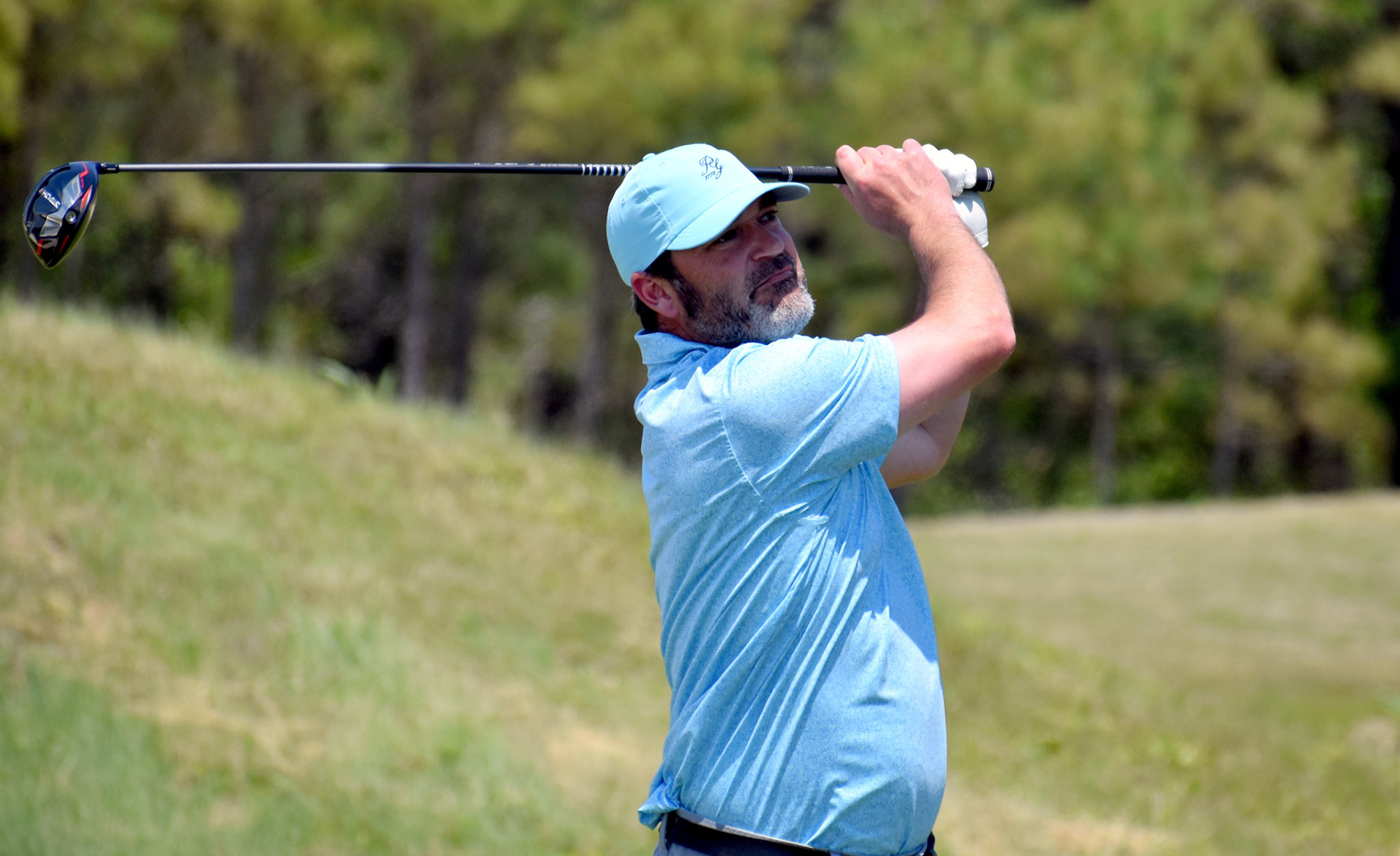 Ryan Stinnett watches his drive on 5.