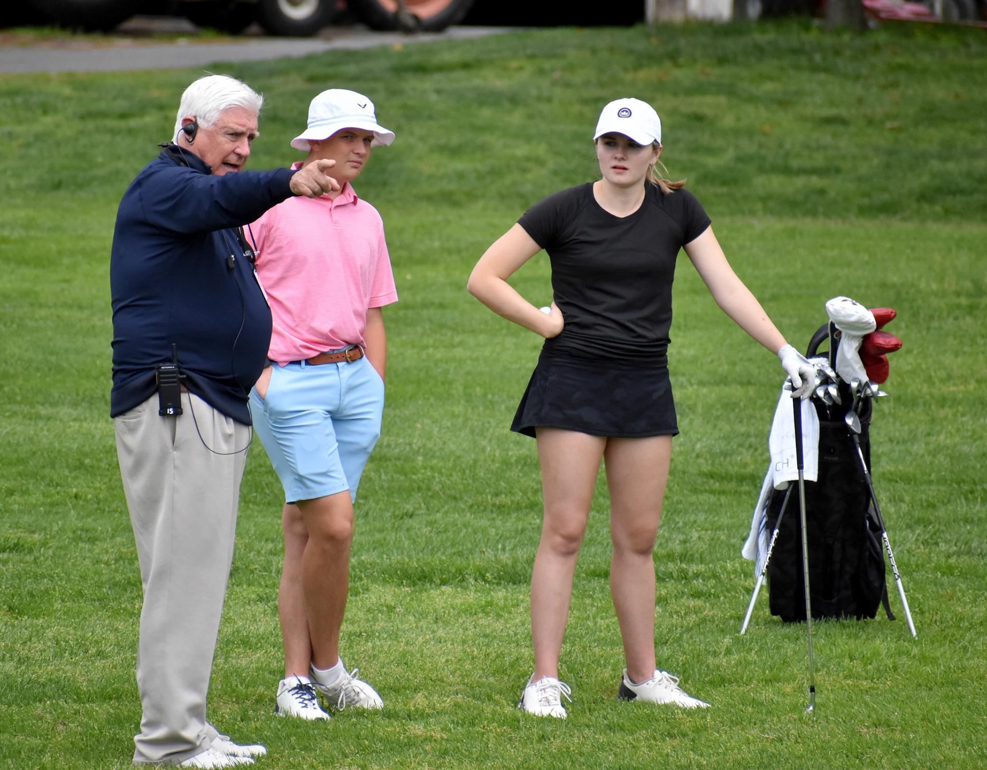 Rules official Lynn Blasch helps Katelynn Waclawski with a ruling on No. 6.