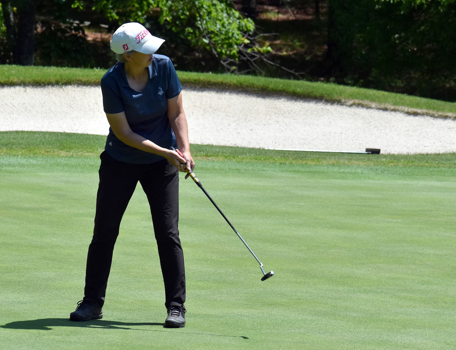 Amy Phelan watches her long putt on 10.