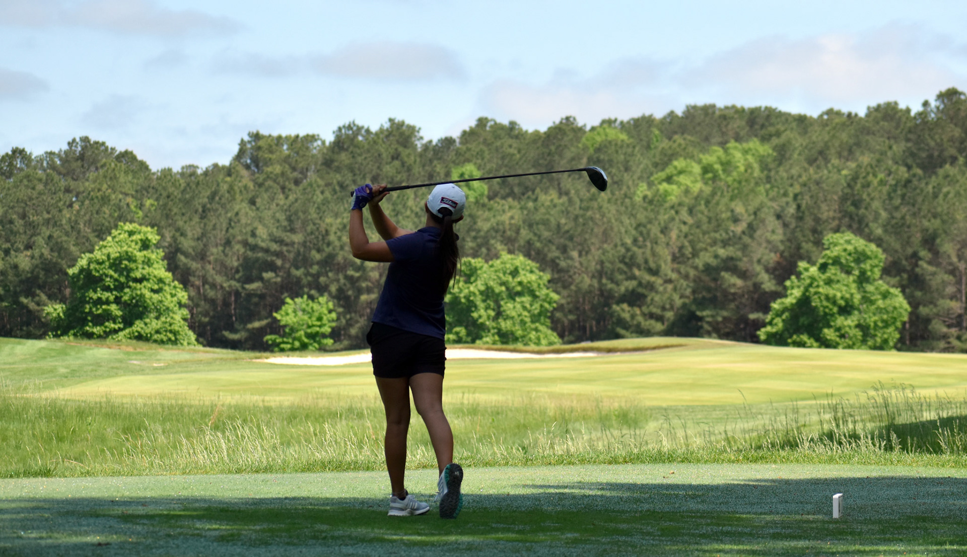 Sydney Hackett watches her drive on No. 11 at Fawn Lake