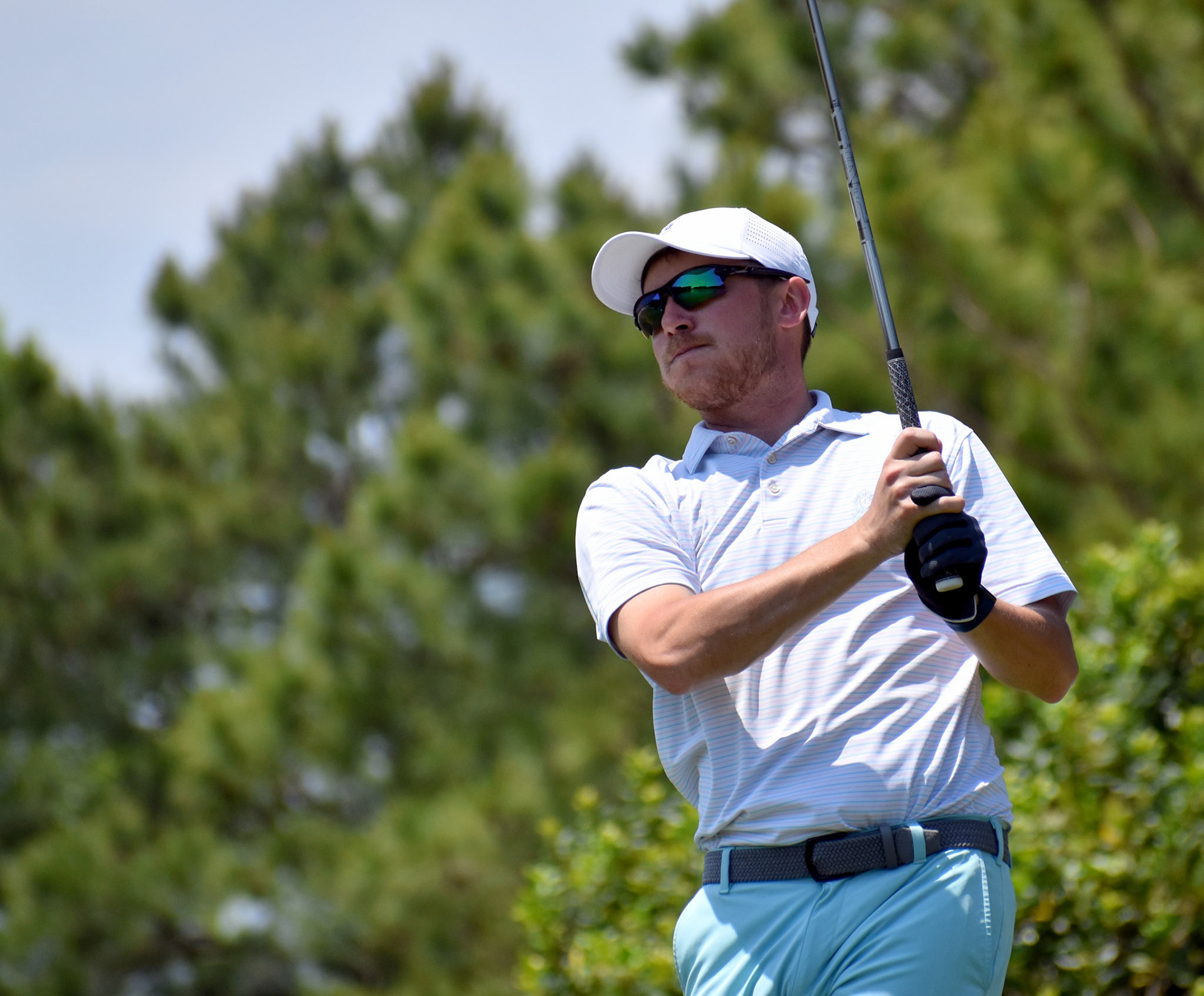 Conor Cafferty watches his drive on 9.