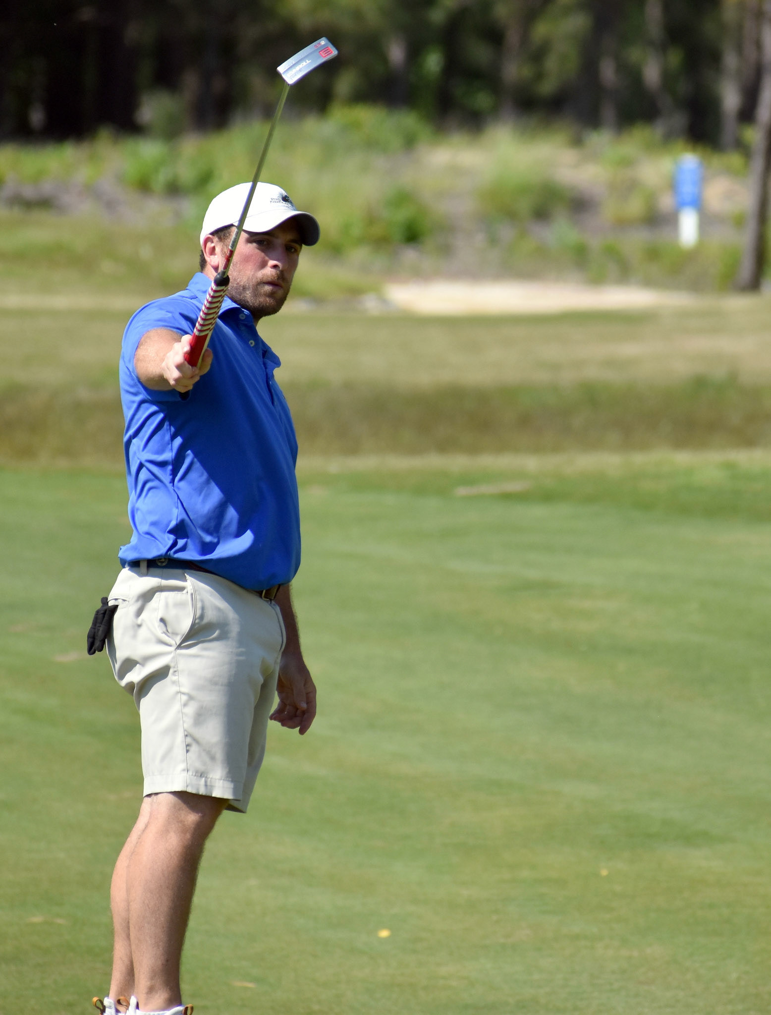 Greg Pappas tries to will his birdie putt in on 6.
