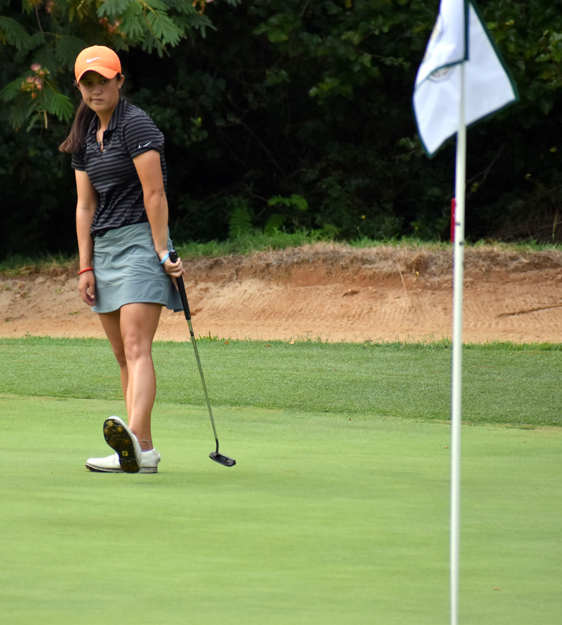Kendall Turner reacts to a missed birdie putt on 12