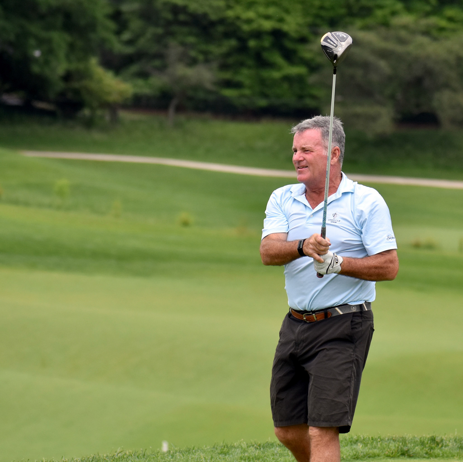 Rich Buckner watches his drive on 16.
