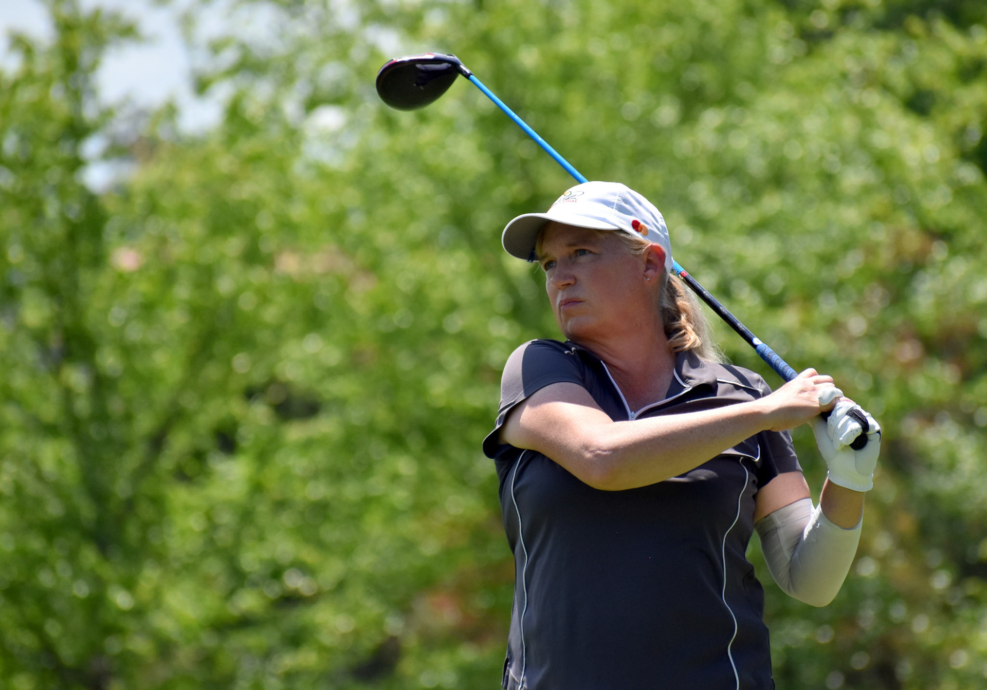 Andrea Miller watches her drive on 10.