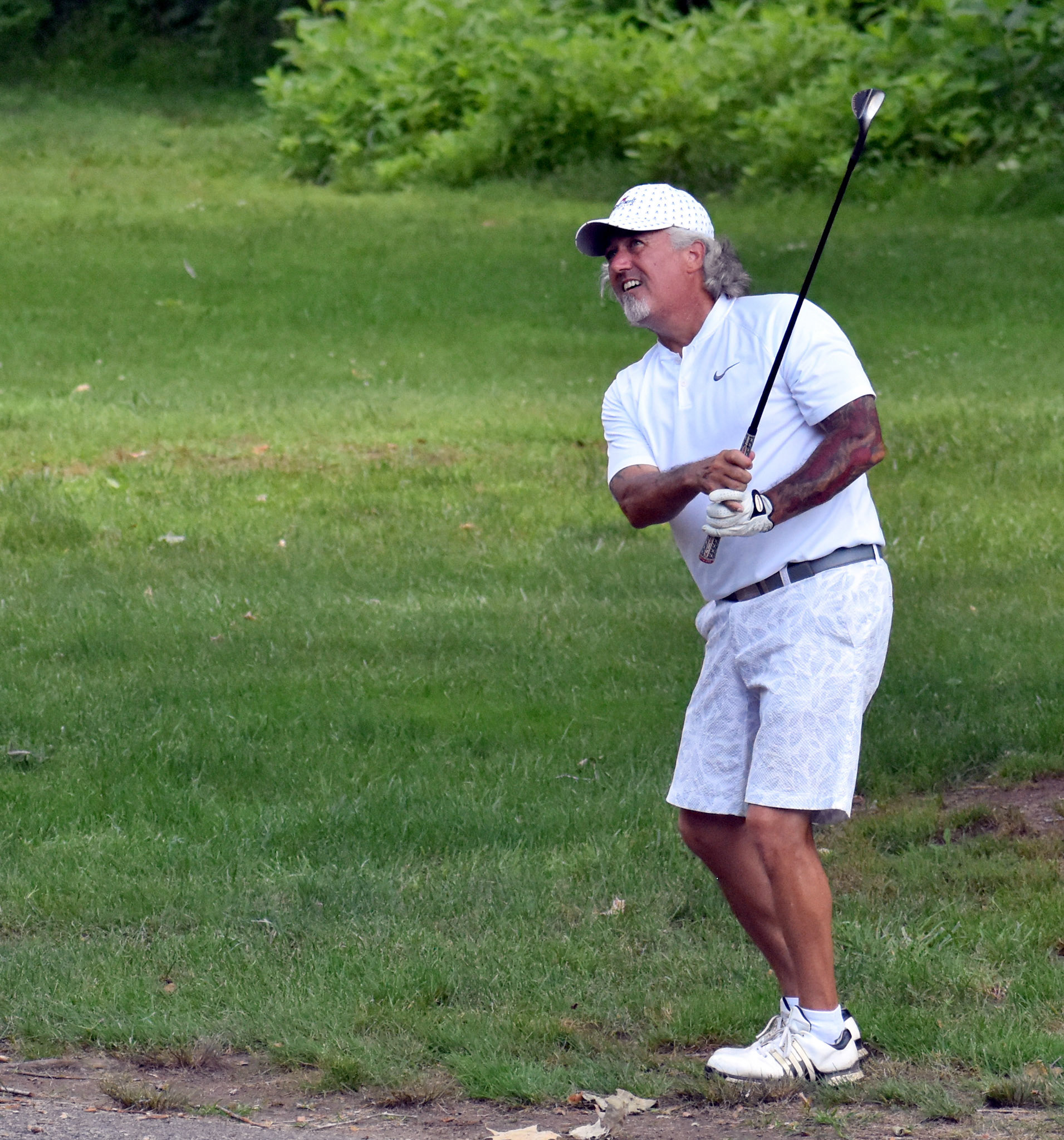 Roy Patterson watches his flop to 12 green. He'd get up and down for par from here.