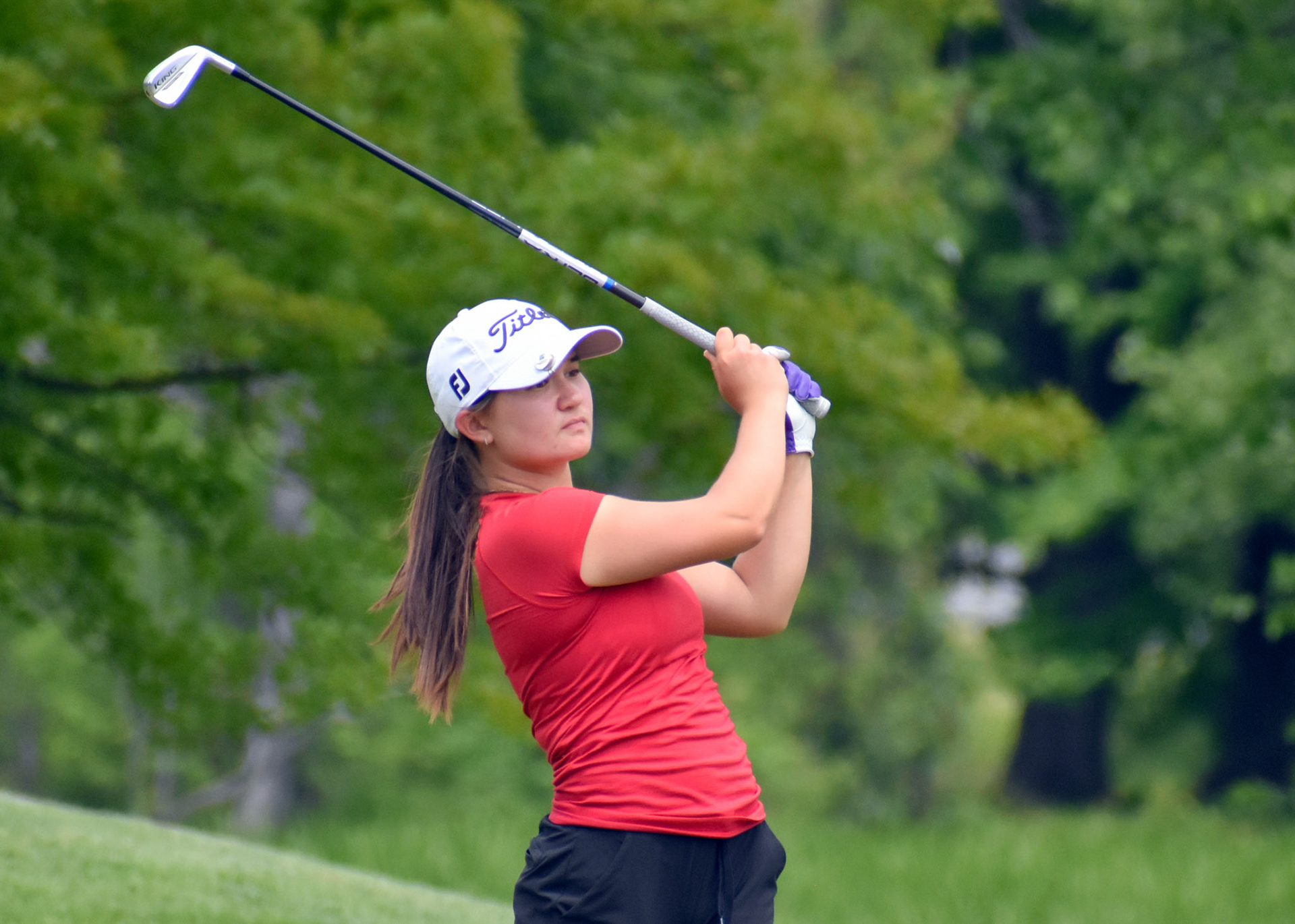 Sydney Hackett tees off on 17.