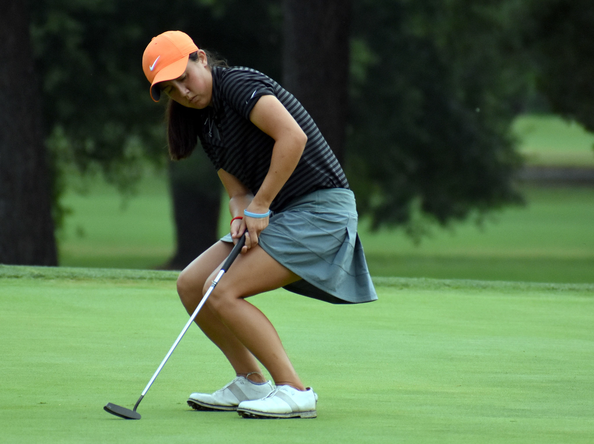 Kendall Turner reacts to a missed birdie putt on 13
