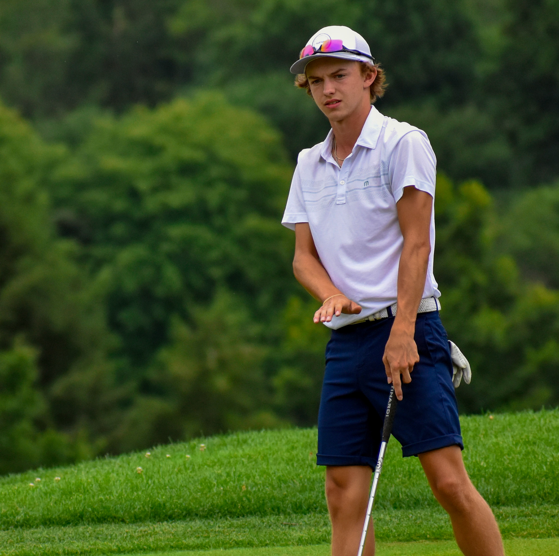 Austin Smith urges his putt to slow down on 8.