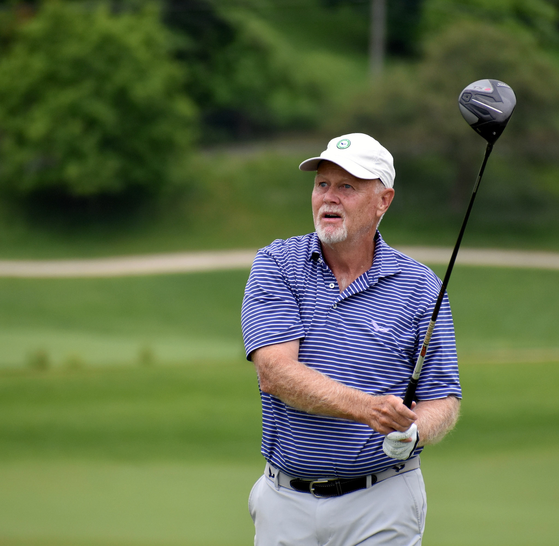 Ron Clatterbuck tees off on 16.