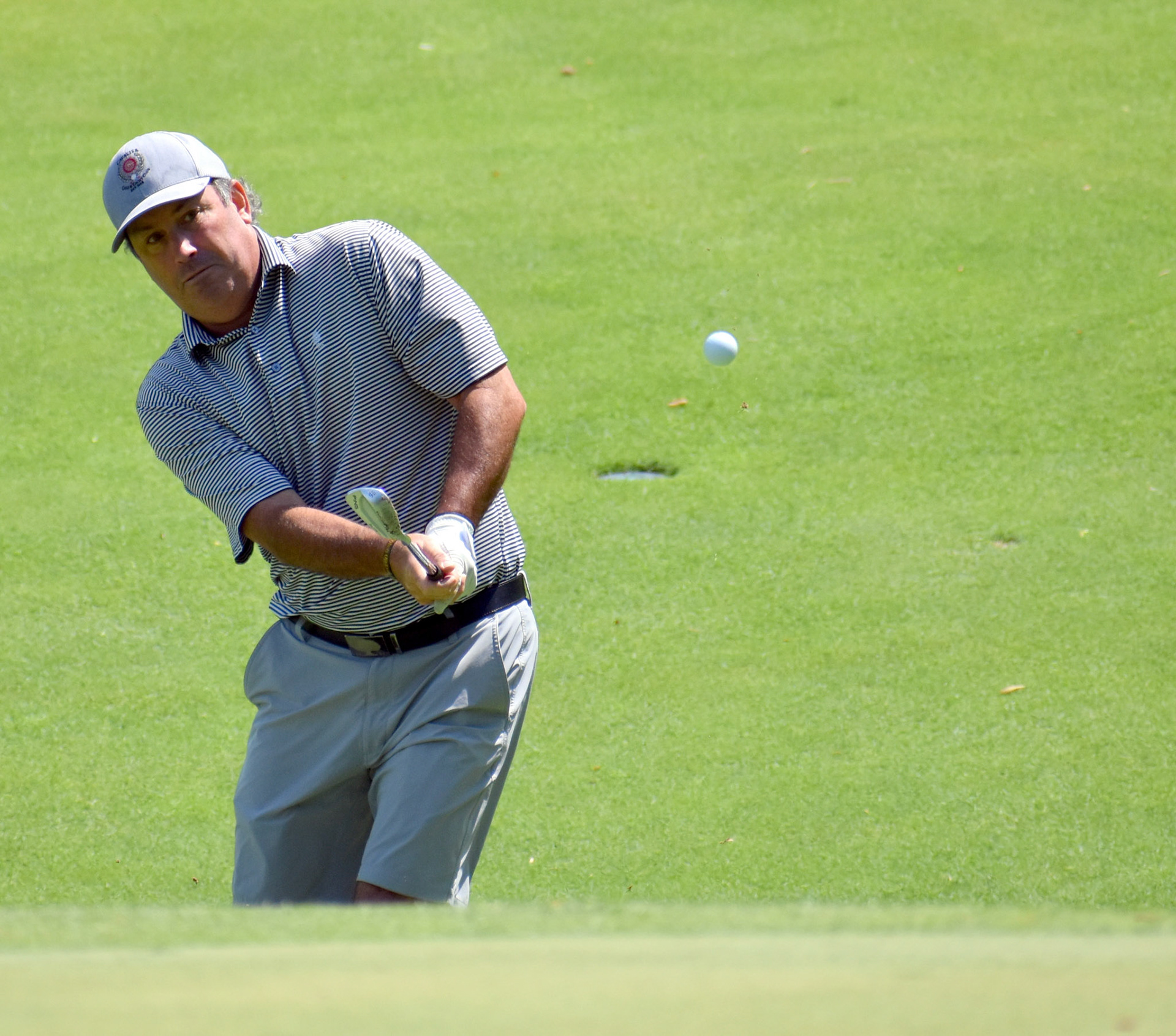Jay Serrao chips to 12 green