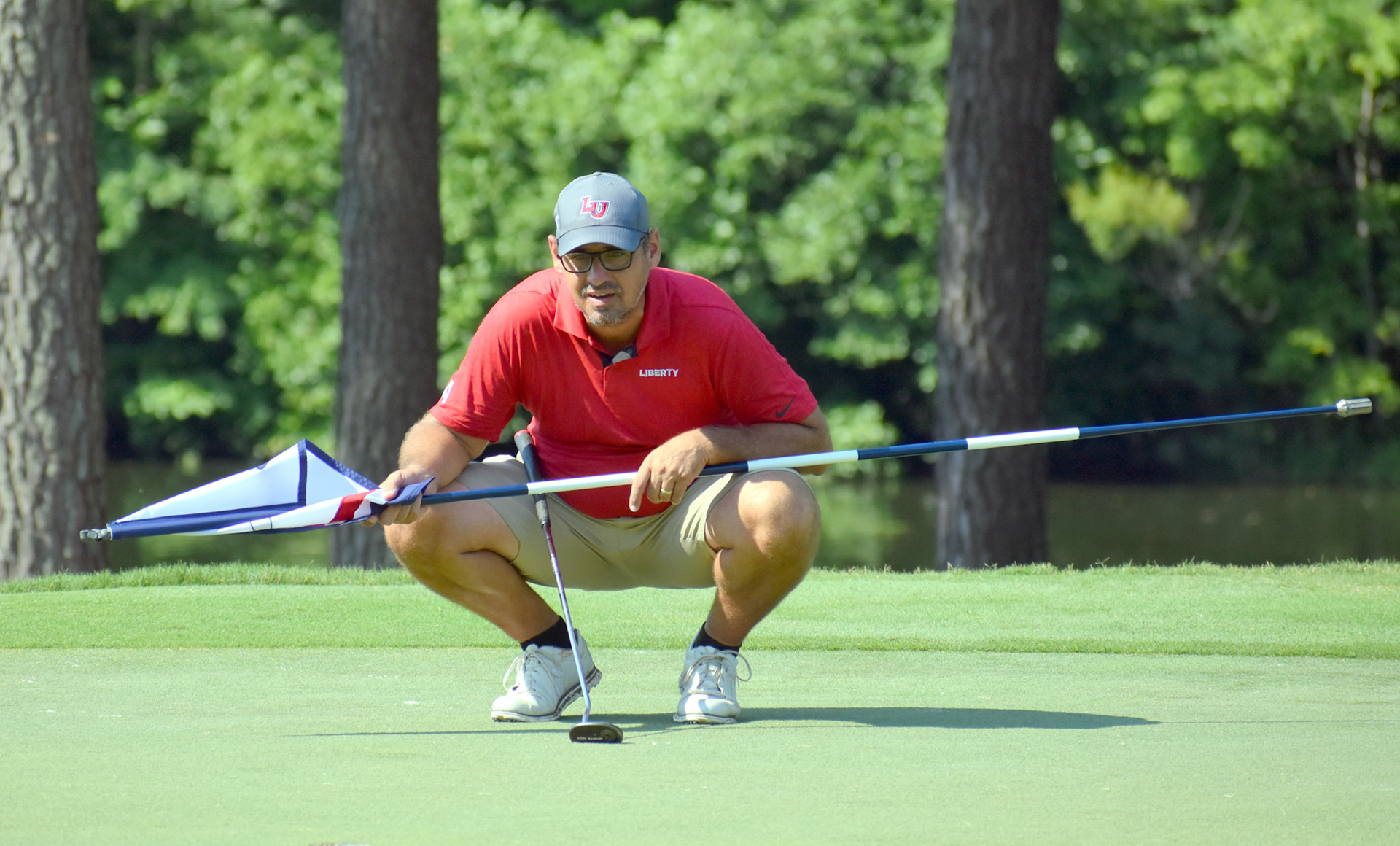 Jeff Thomas gets a view of his putting line on 1