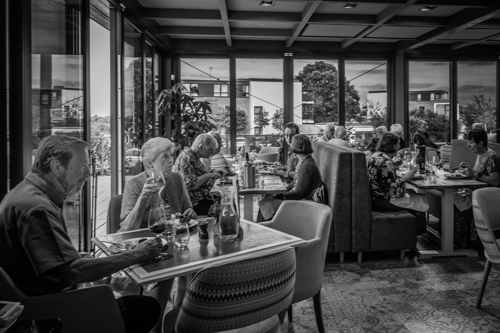 The Greenhouse at its best — a place of shared meals, conversation, and community. The buzz of the evening service extends beyond the kitchen into every table.