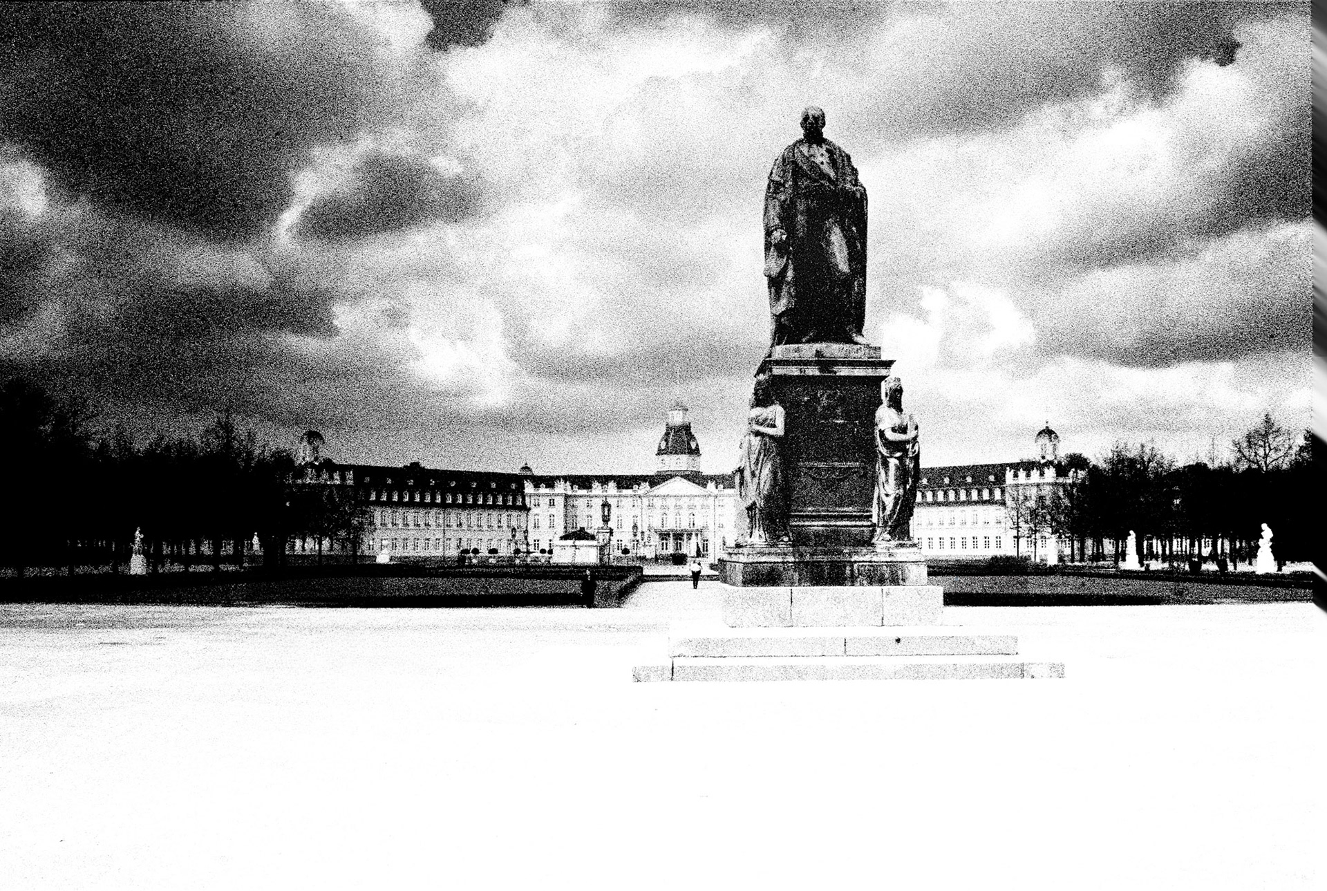 The statue of Karl Friedrich stands on the central axis of Karlsruhe Palace, anchoring the geometry of the Baroque gardens.