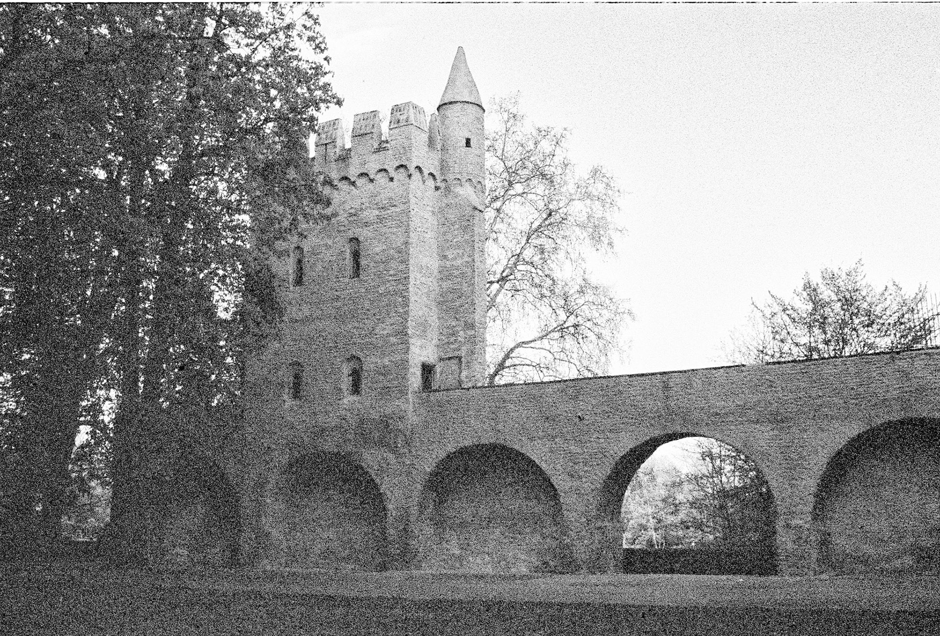 Arched openings in the medieval town walls of Bad Wimpfen lead the eye toward a crenellated tower, echoing the town’s imperial past.