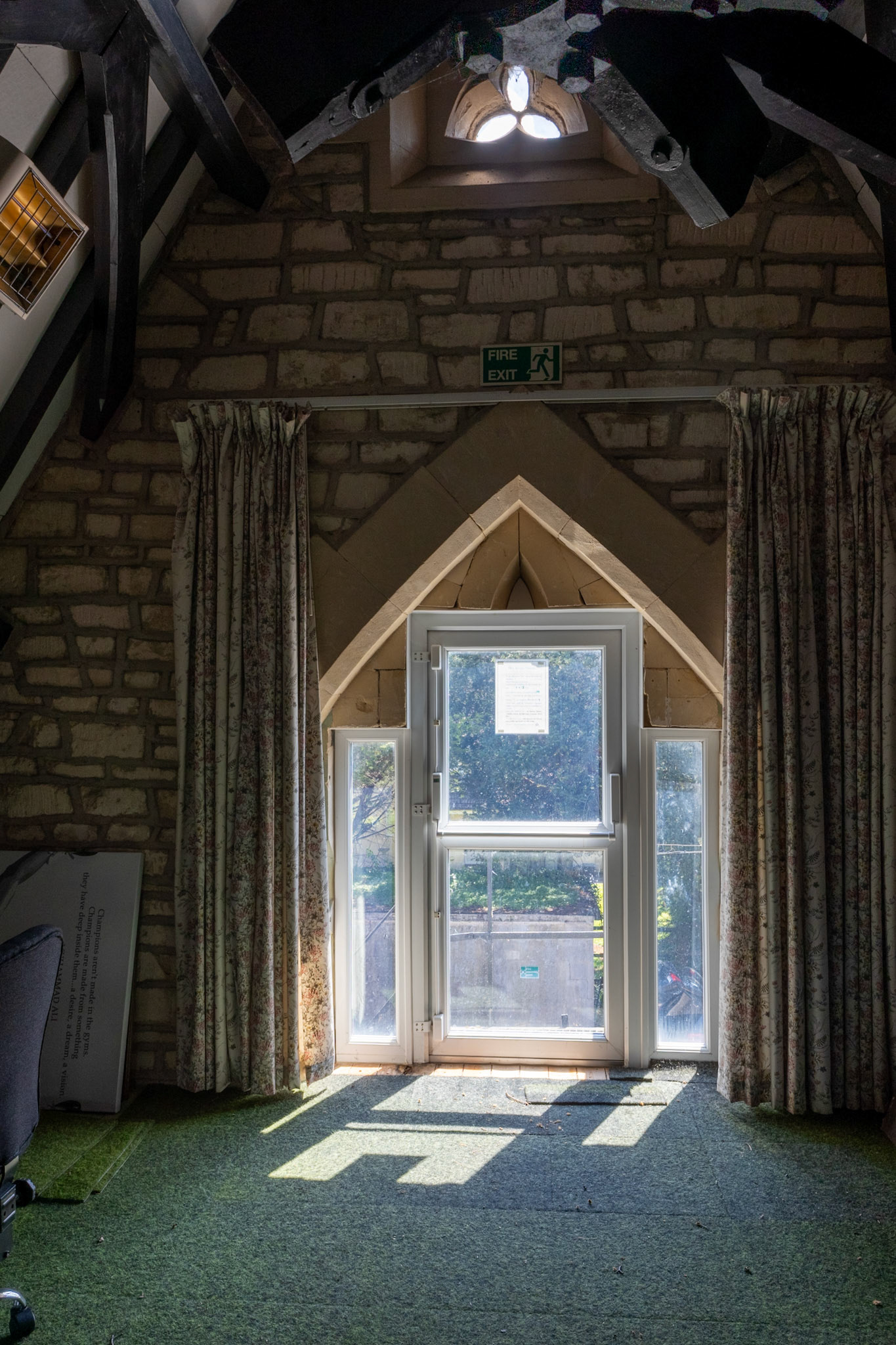 UPVC Door has no lintel above or below it.  It is resting on the end of floorbooards that have rotted and is supporting the weiht of stones above,